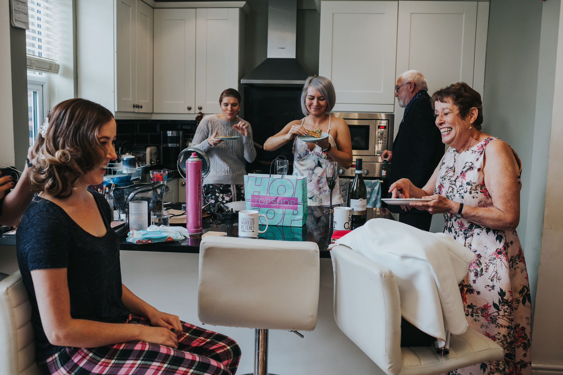 Bridal party laughing together in Chorlton.