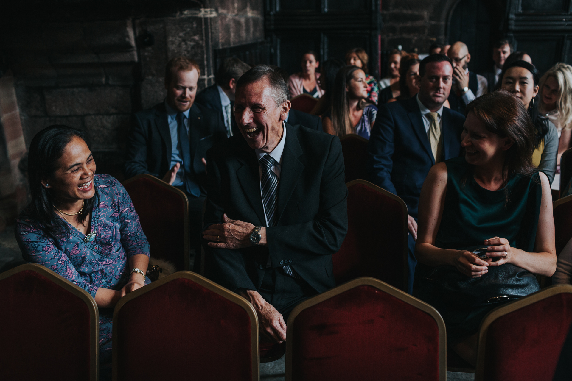 Guests laugh inside Chetham Library. 