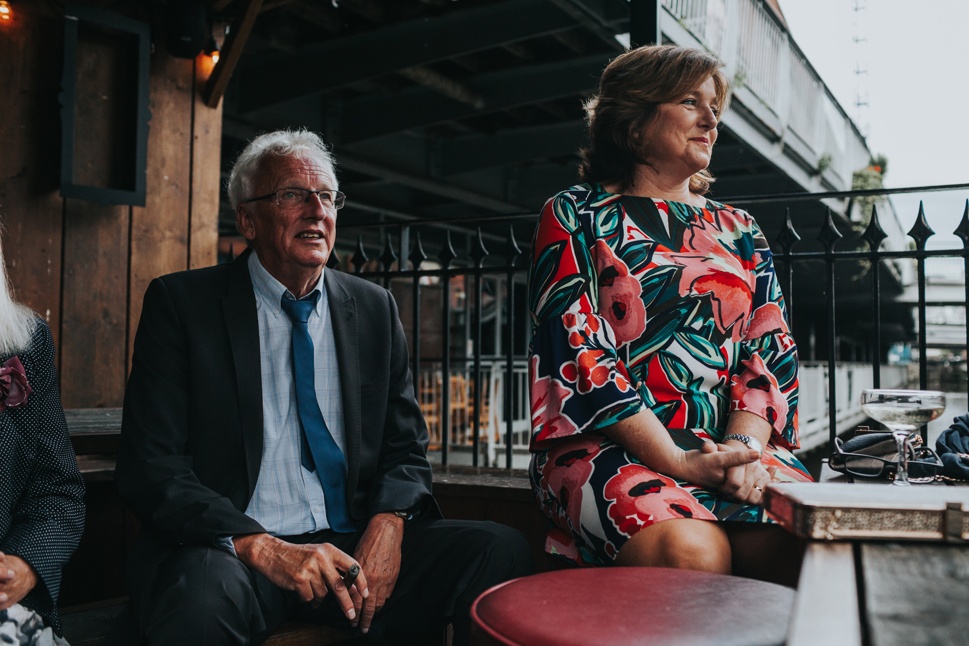 Wedding Guests sit on Balcony at Lock 91. 