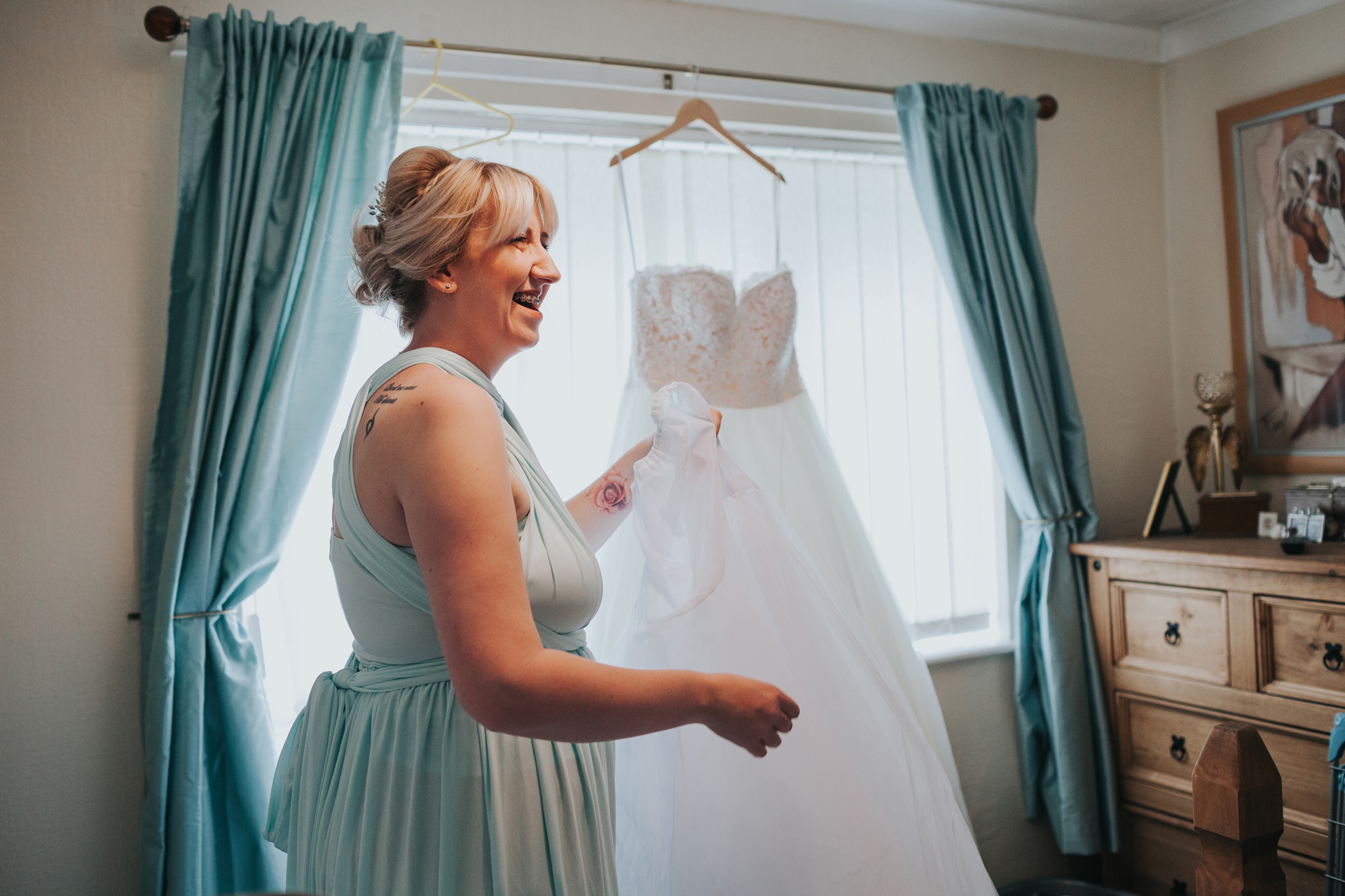 Bridesmaid laughs. 