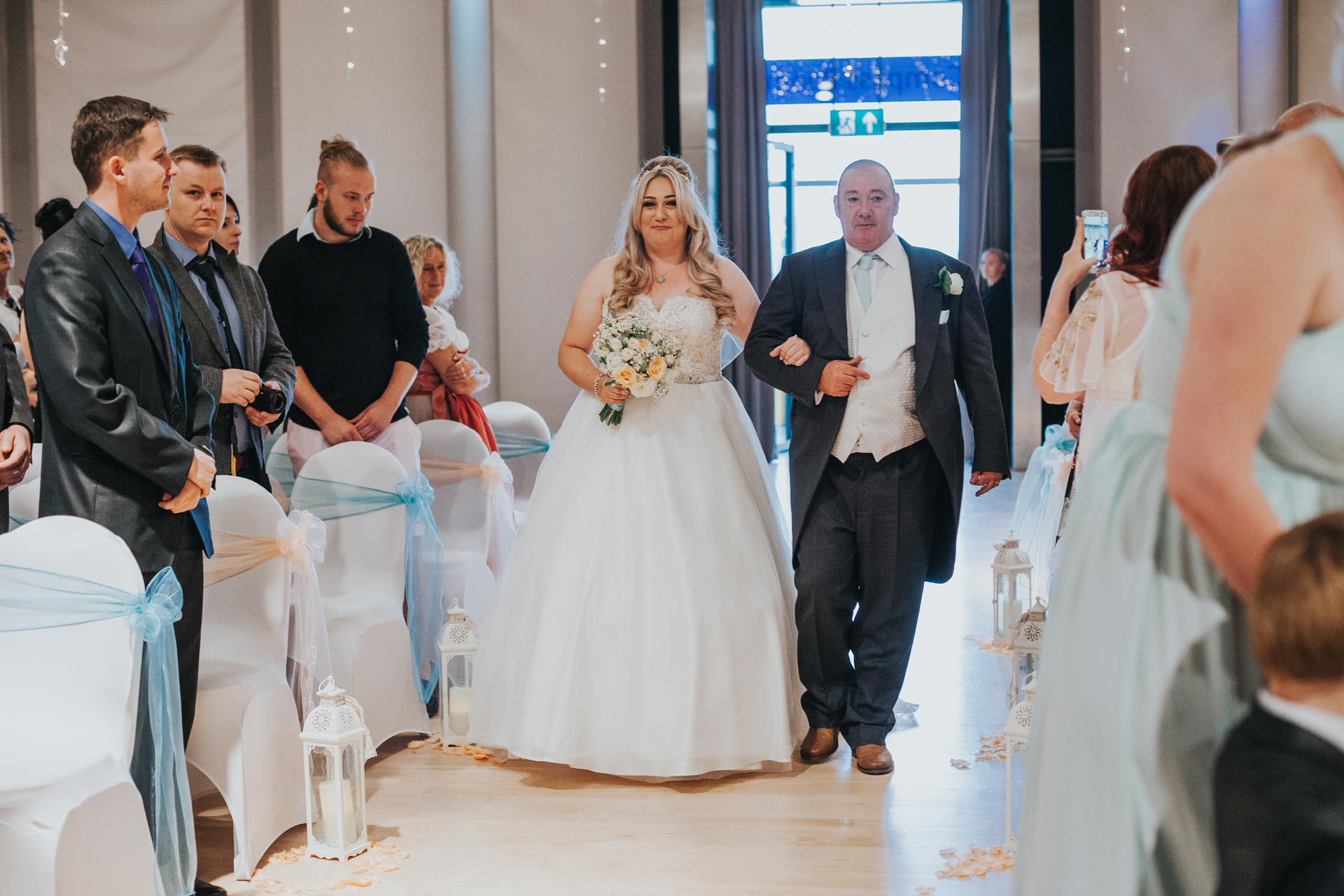 Bride and her father walk down the aisle in The Compass Room. 