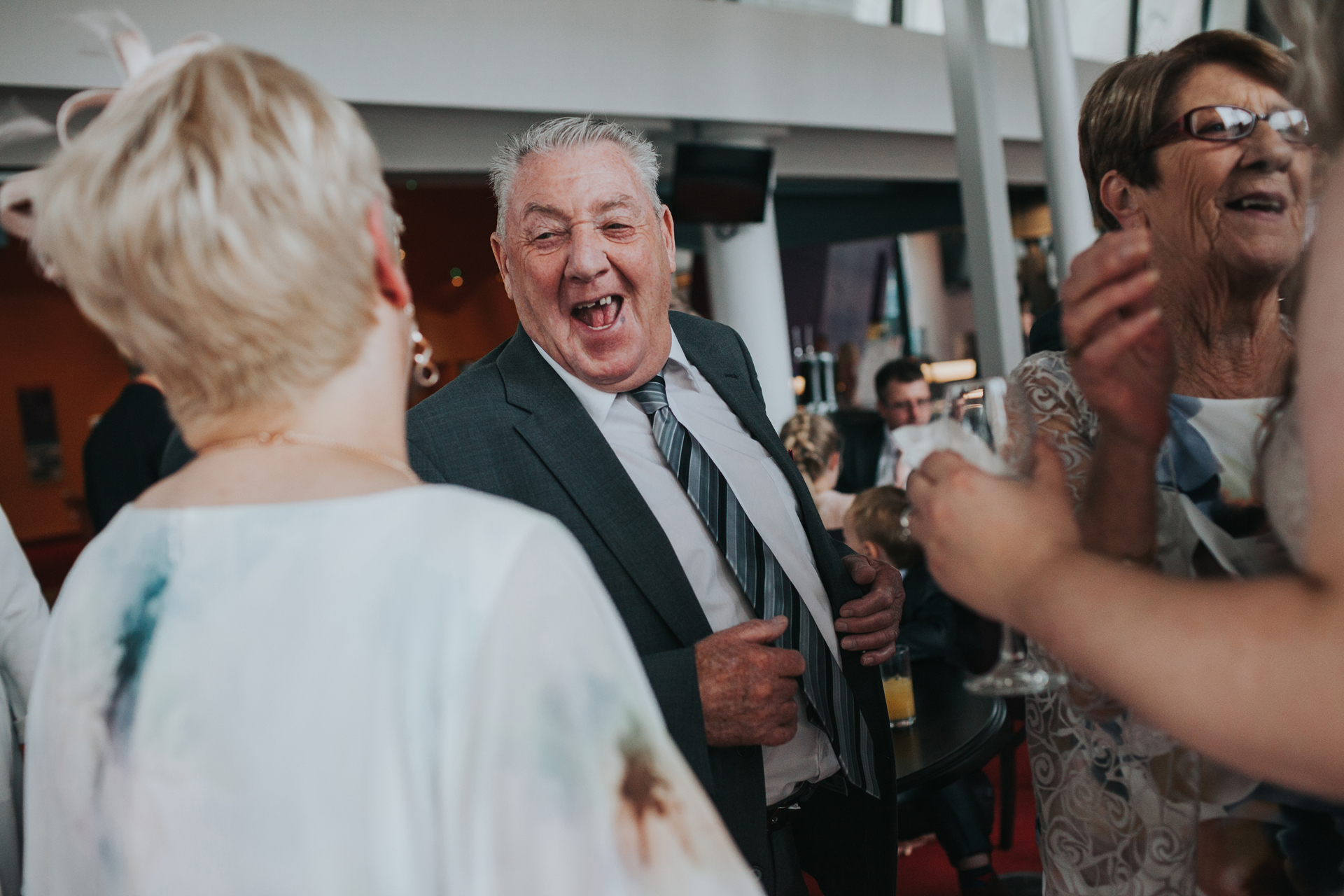 Wedding guests roars with laughter. 