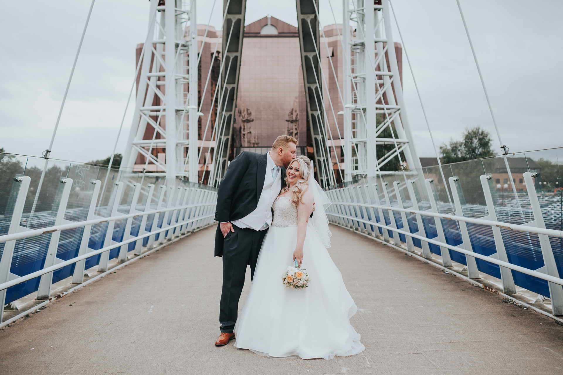 Bride and Groom have a photo on the bridge, 