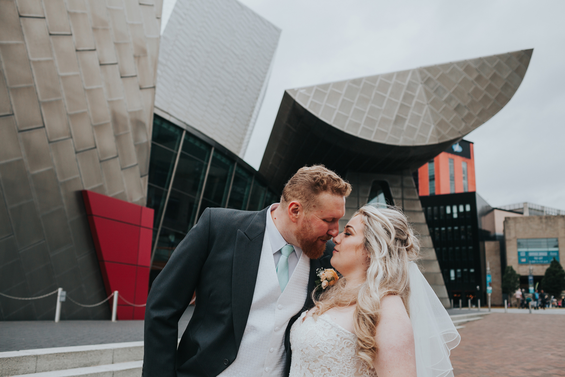 Bride and Groom go nose to nose outside the Lowry Theatre. 