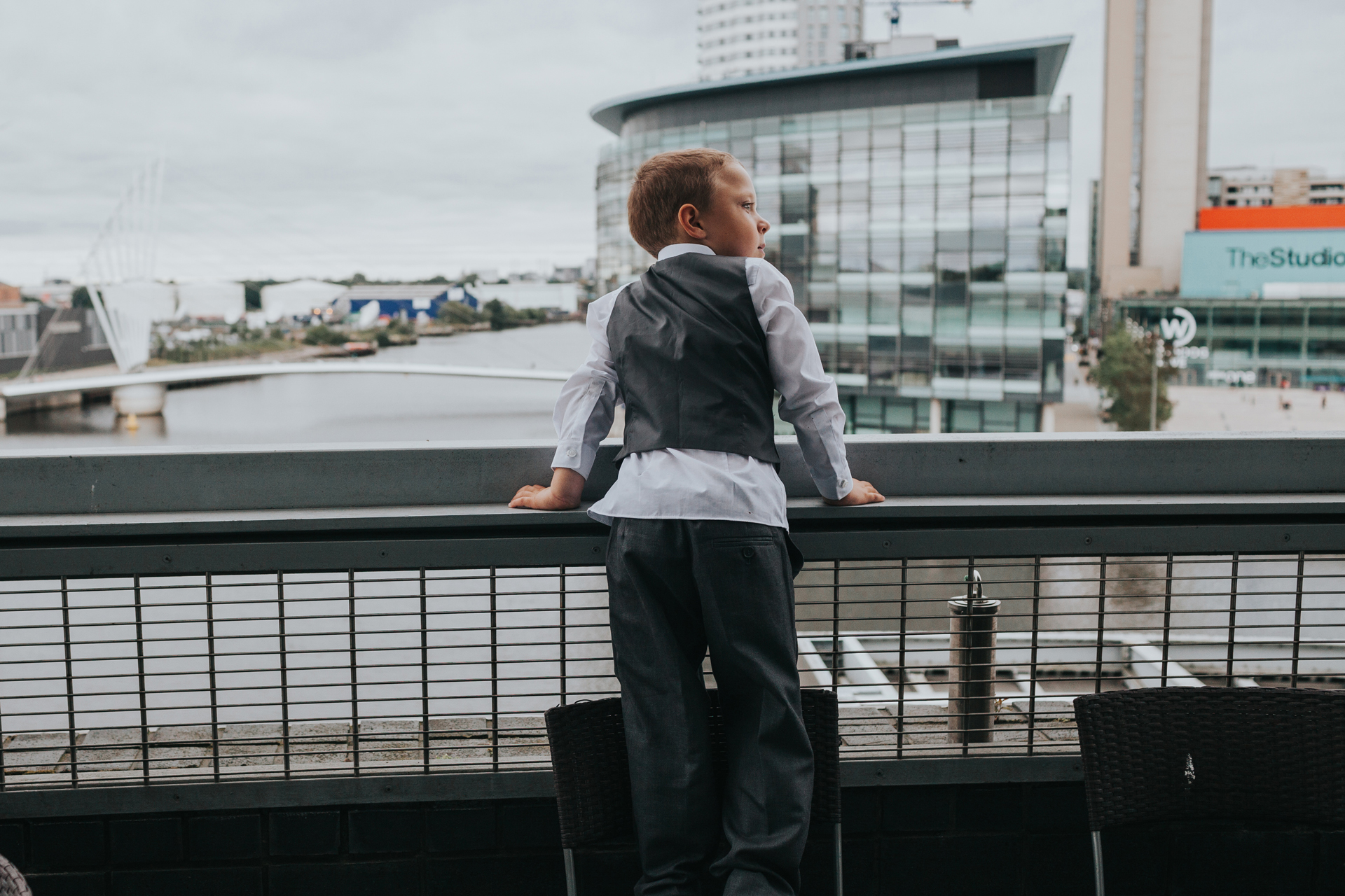 Little boy enjoys the view at The Lowry Theatre. 