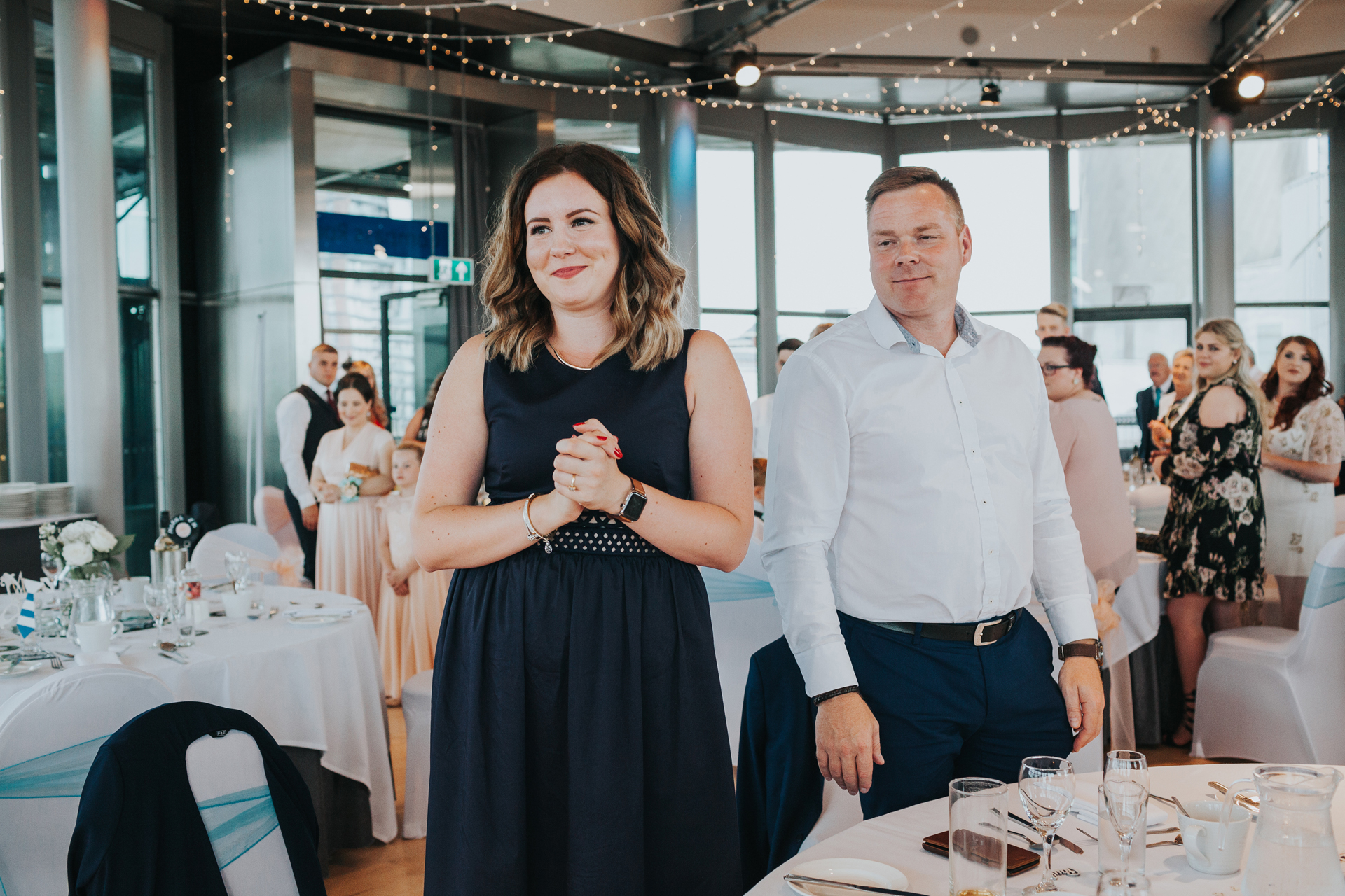 Wedding guests look on wishing this was their wedding. 