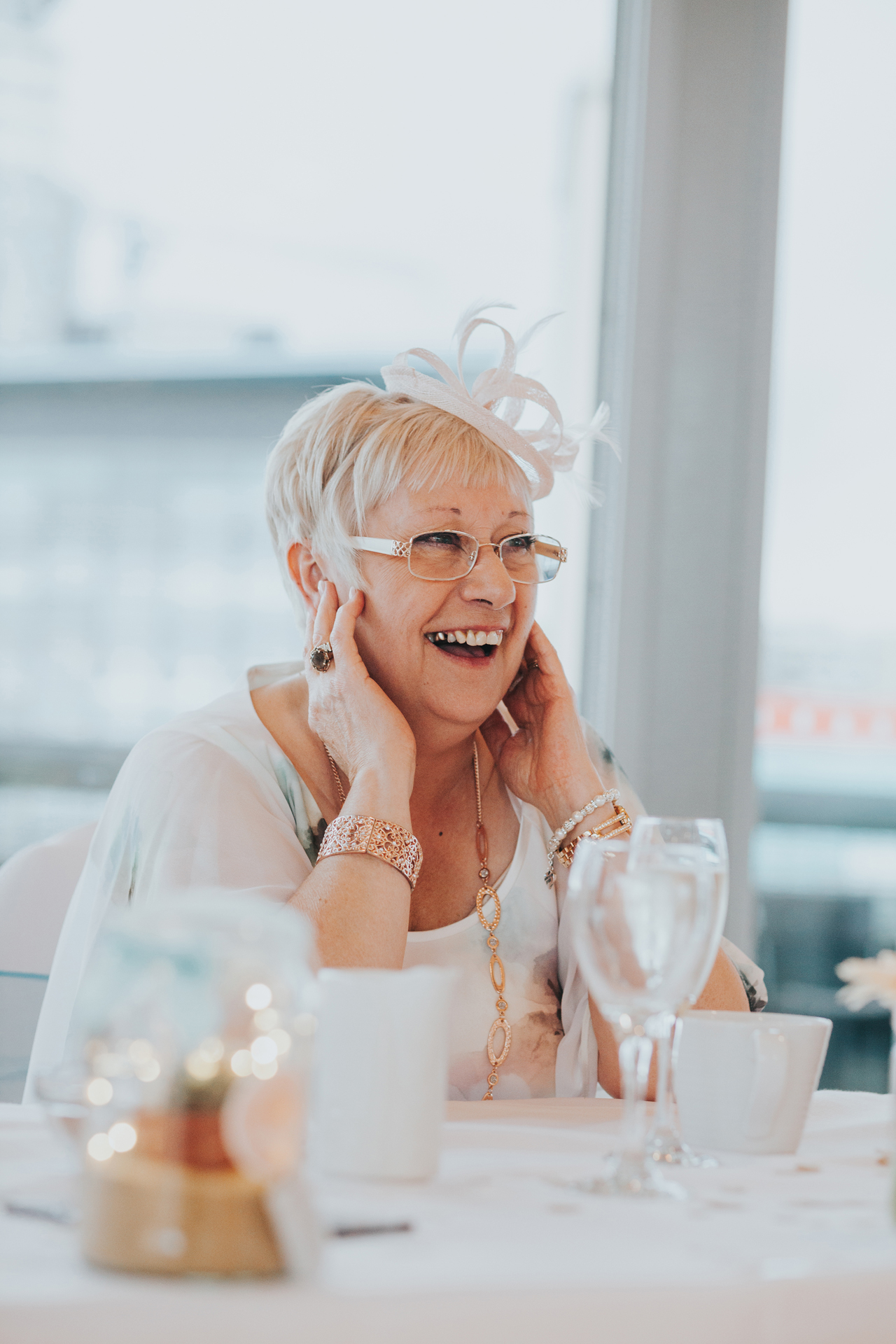 Mother of the bride laughing. 