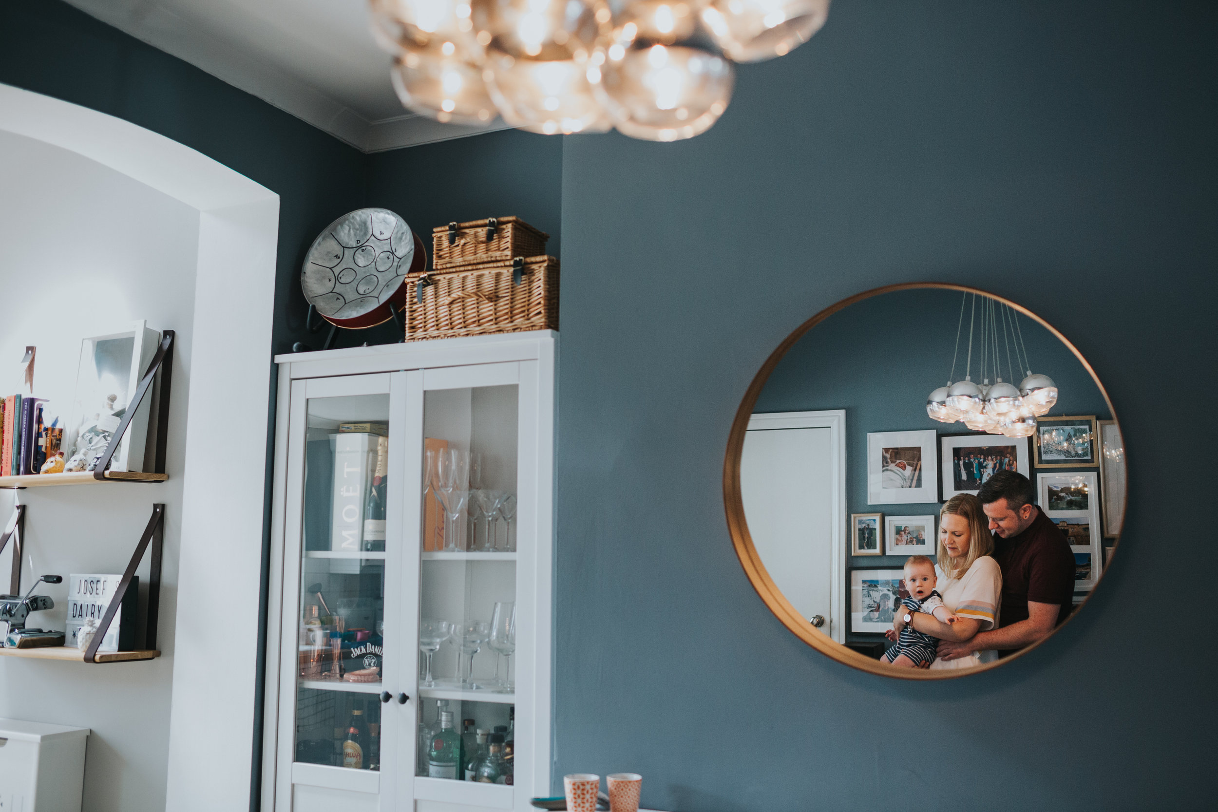 Families reflection in dining room mirror.