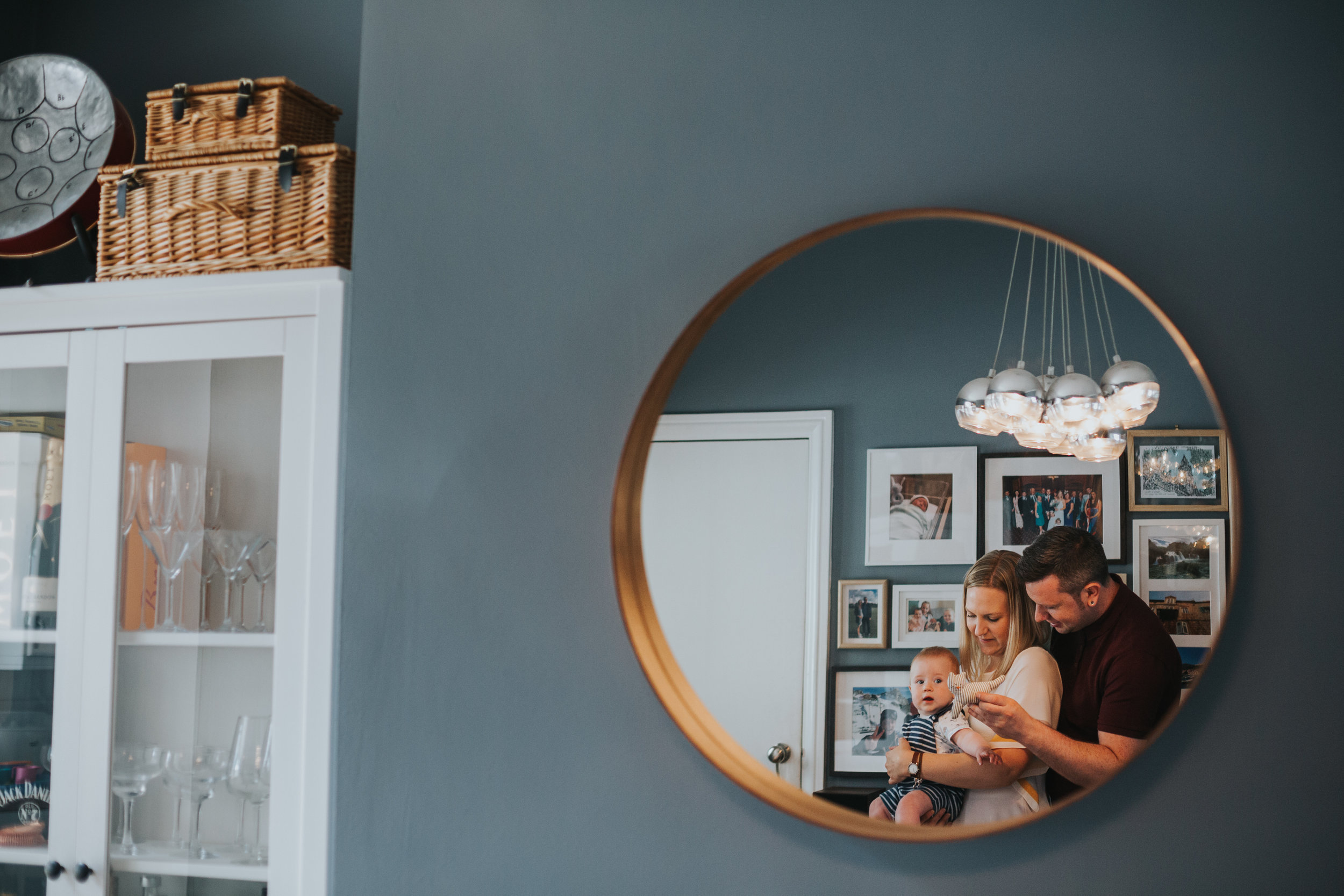 Families reflection in mirror.