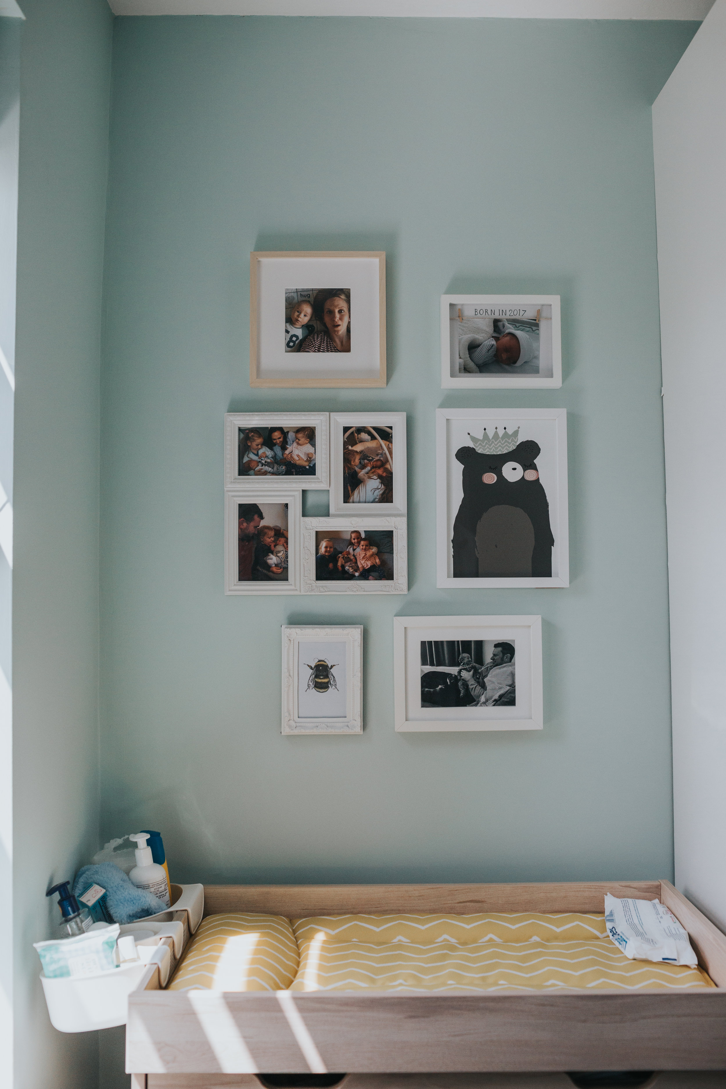 Baby changing mat and photos.