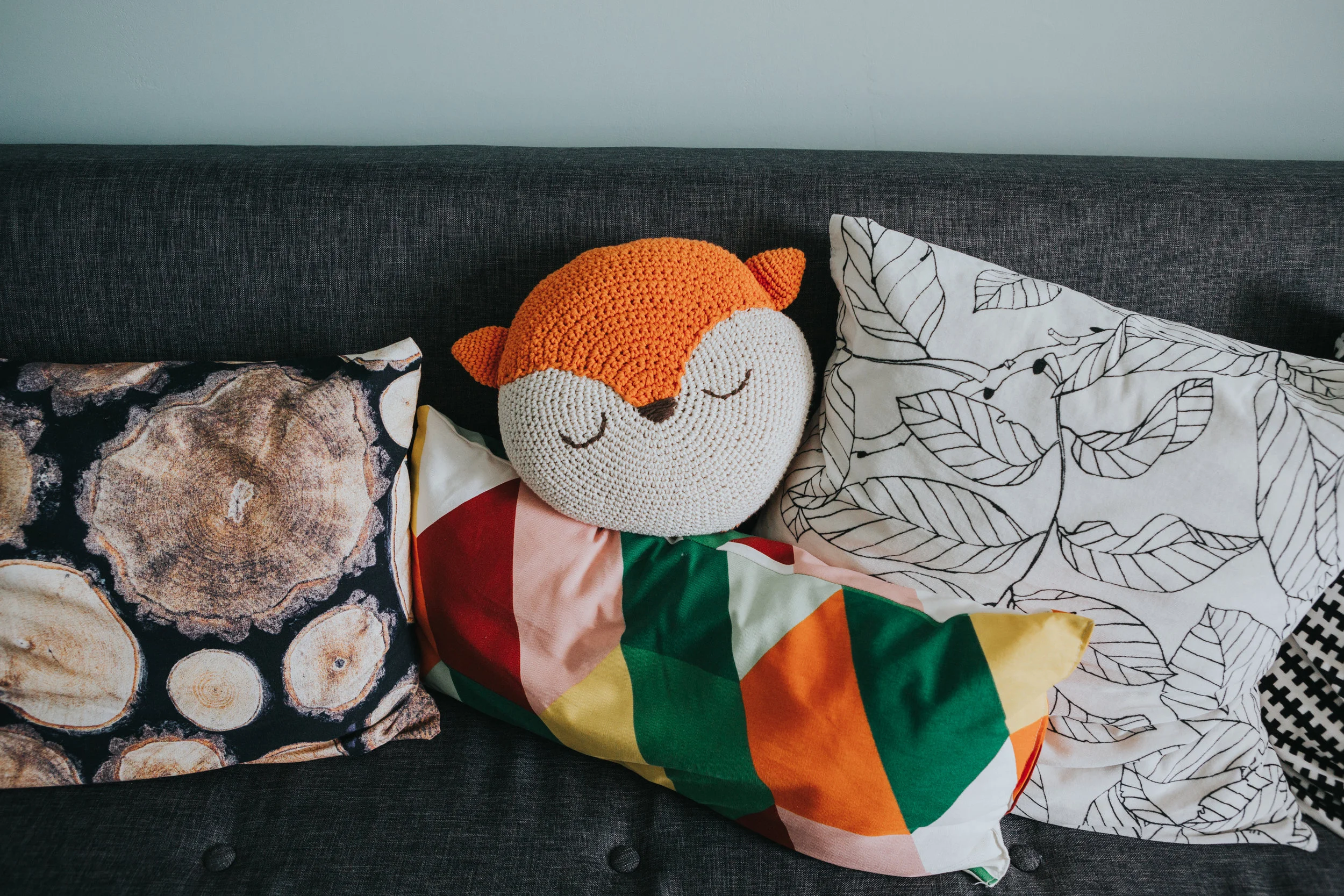 Colourful cushions on sofa. 