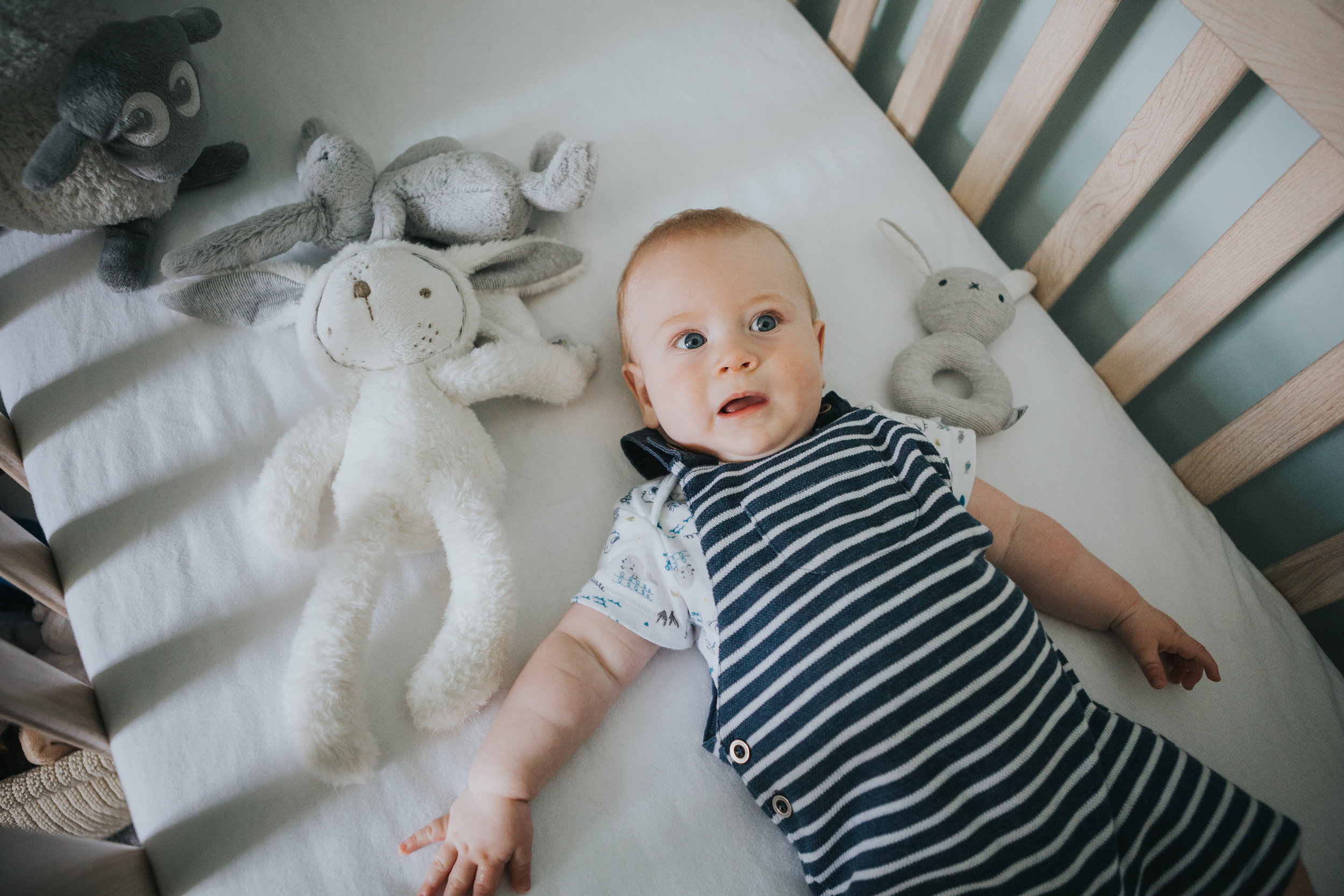 Baby in his cot.