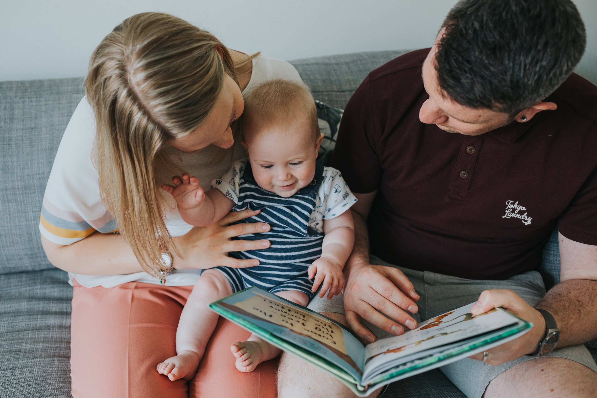 Baby stuns everyone by reading book himself.