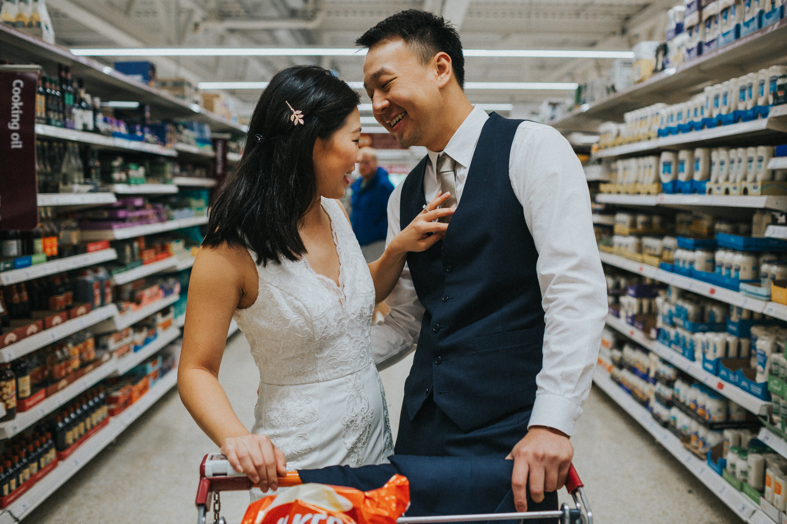 Couple have a moment together in supermarket. 