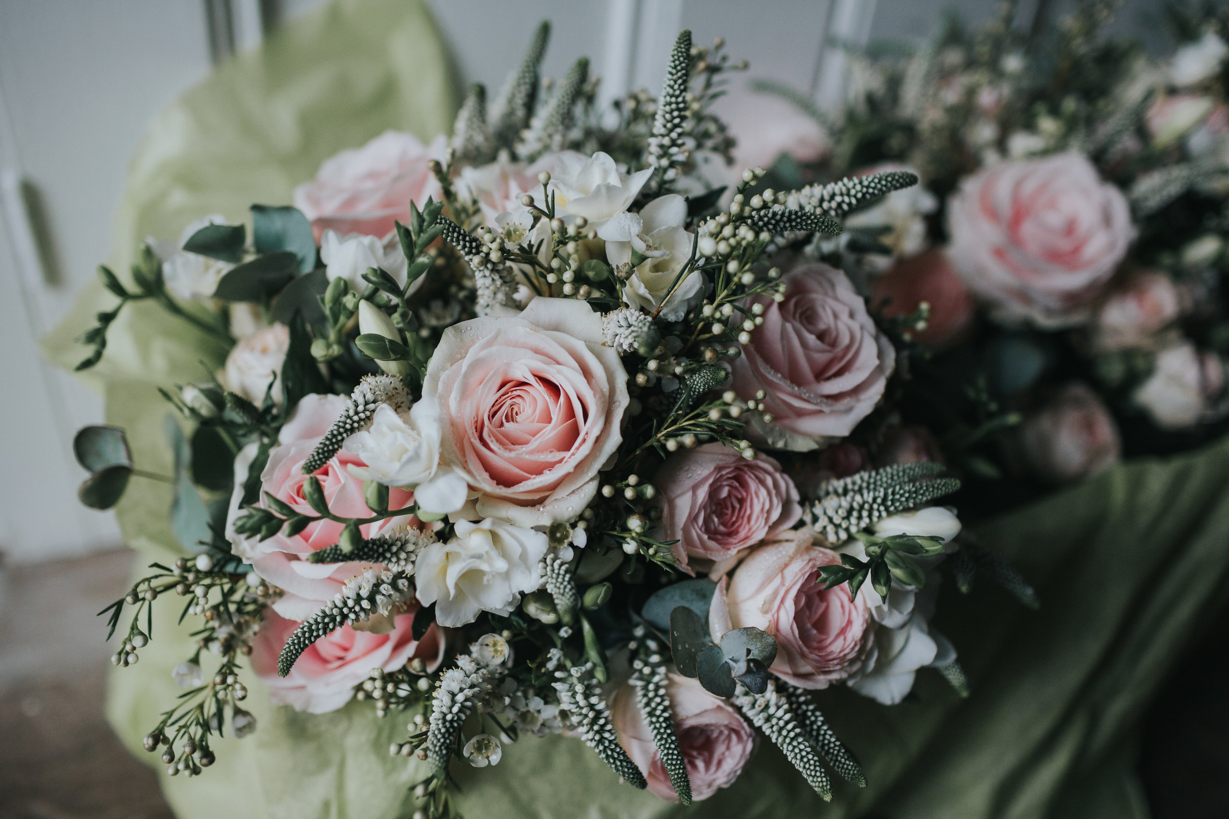 Brides bouquet, pink flowers and pale green leaves.  (Copy)