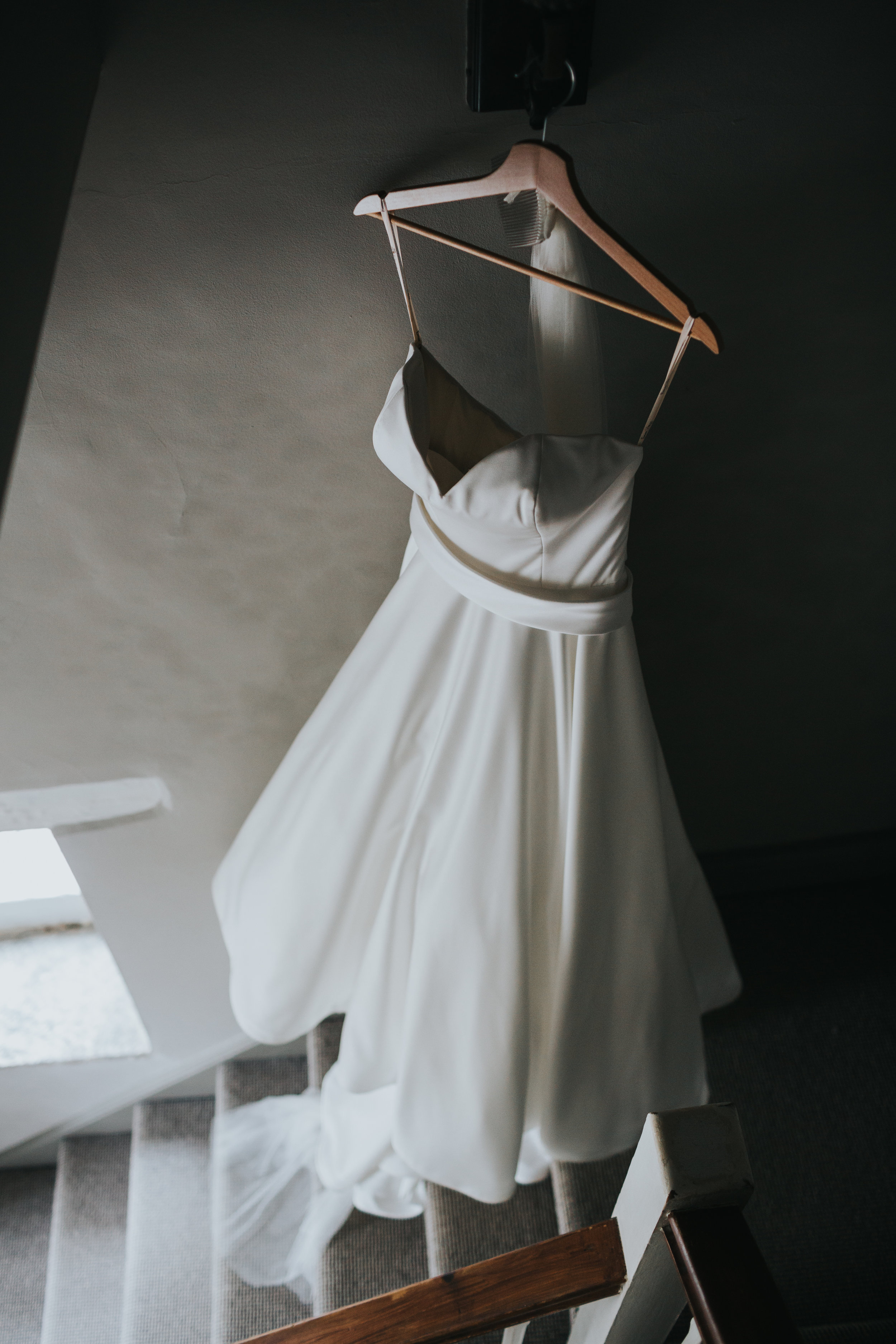 Wedding Dress hanging in the hall way.