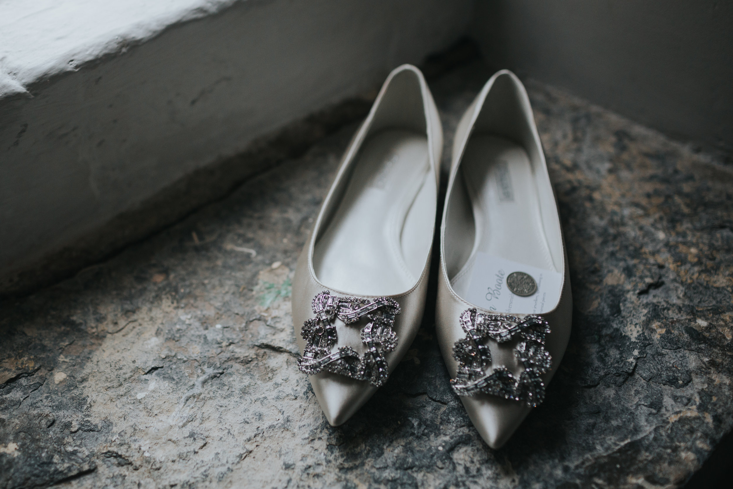 Brides shoes on windowsill with 6 pence inside. (Copy)