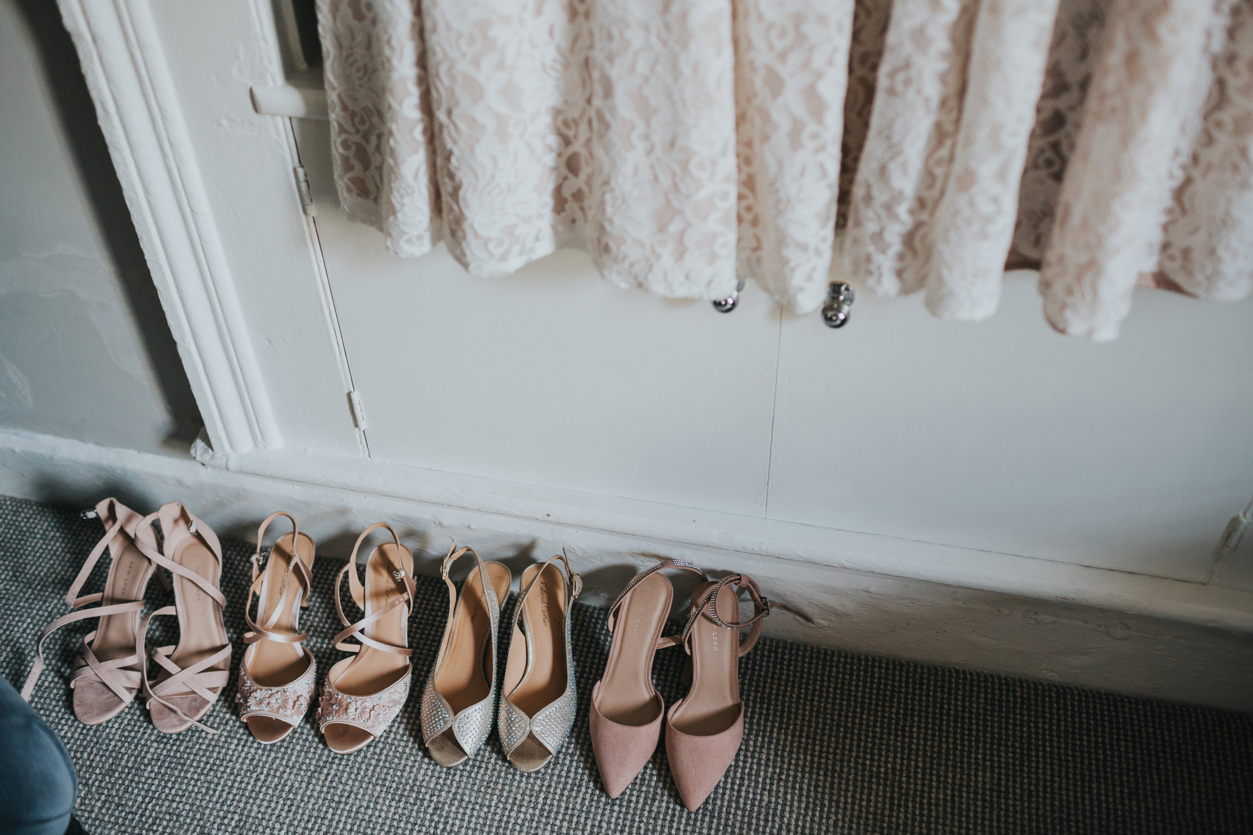 Bridesmaid shoes and the bottom of the bridesmaid dresses.