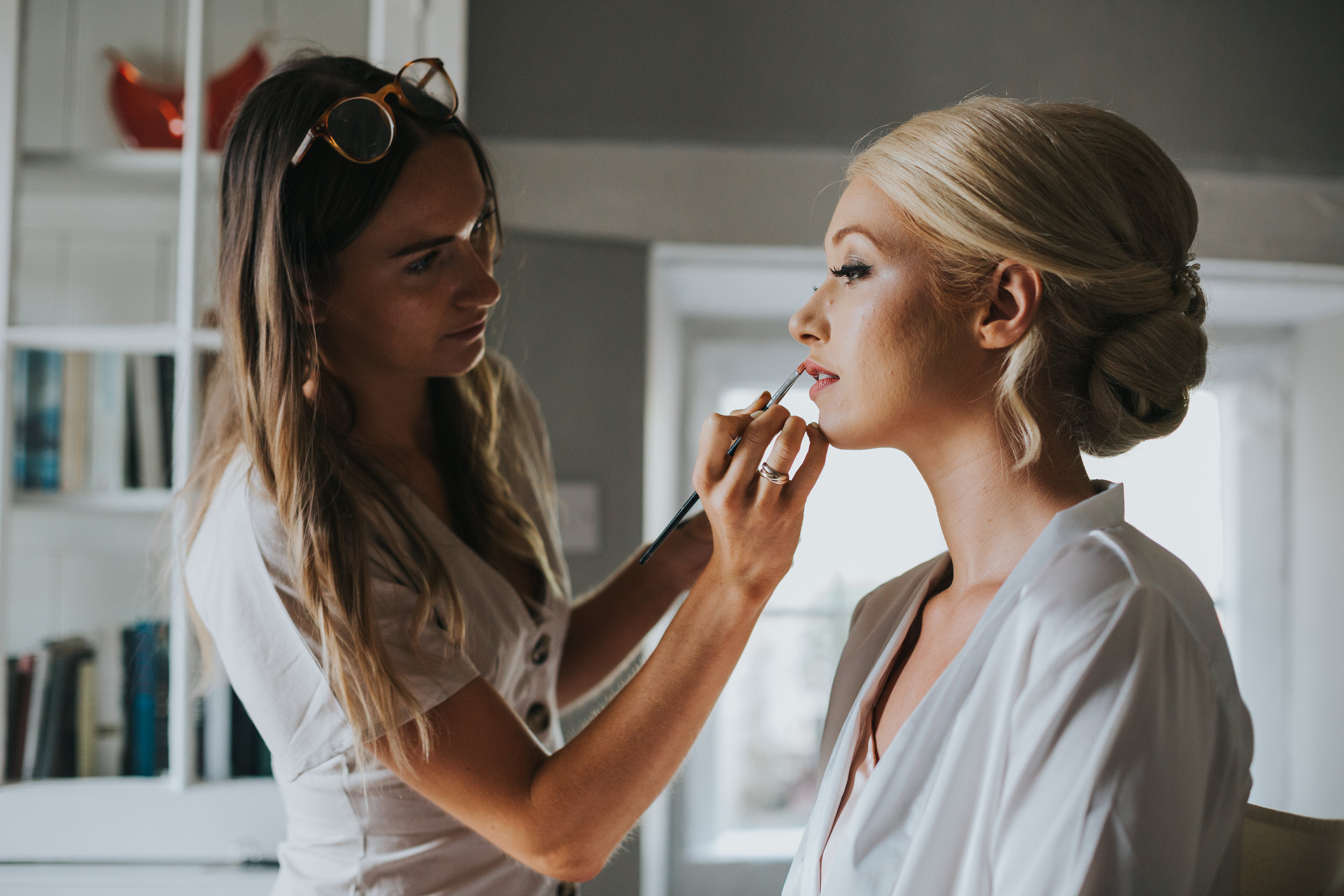 Bride getting her make up put on.  (Copy)