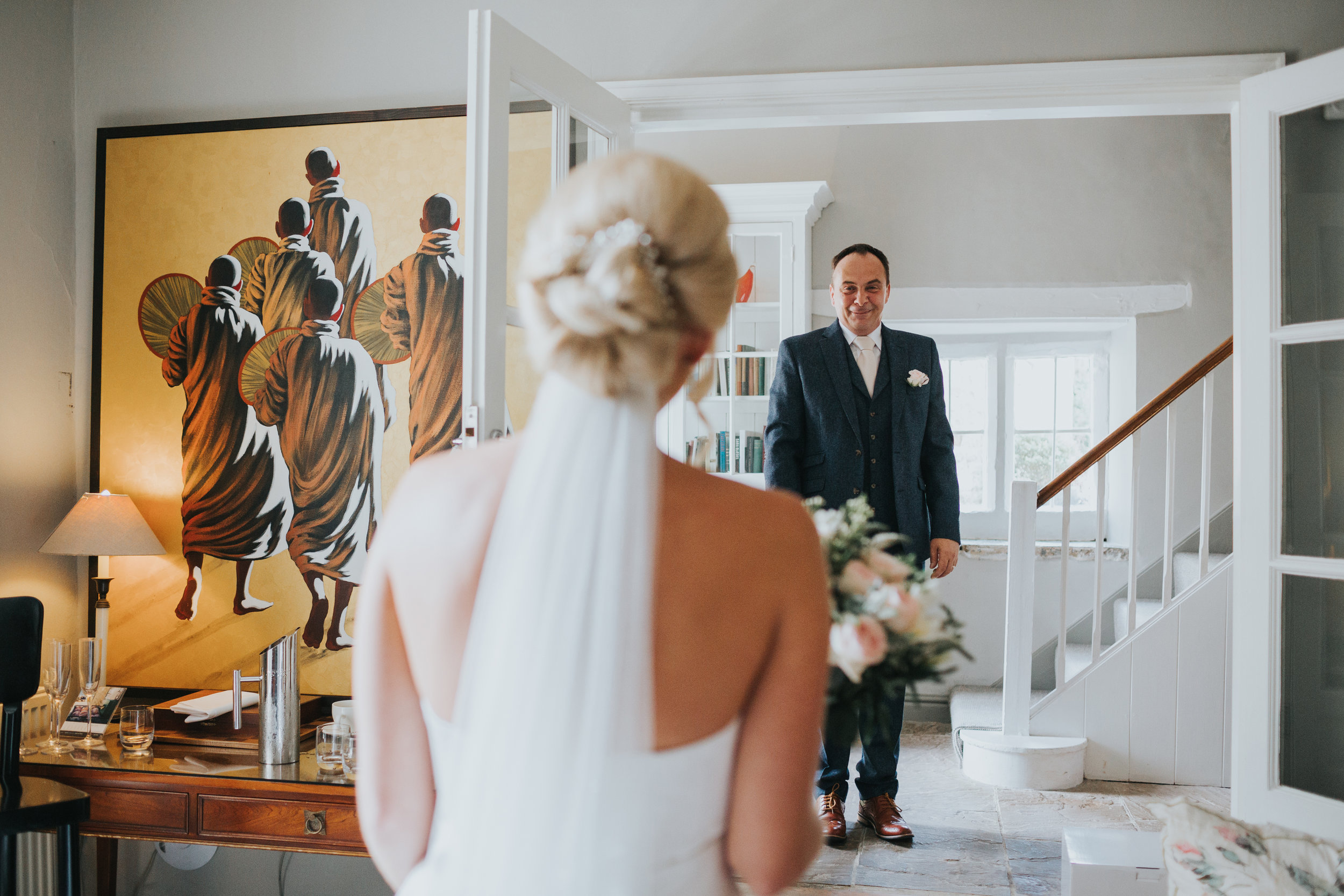 Father of the Bride comes to see his daughter in her wedding dress for the first time.