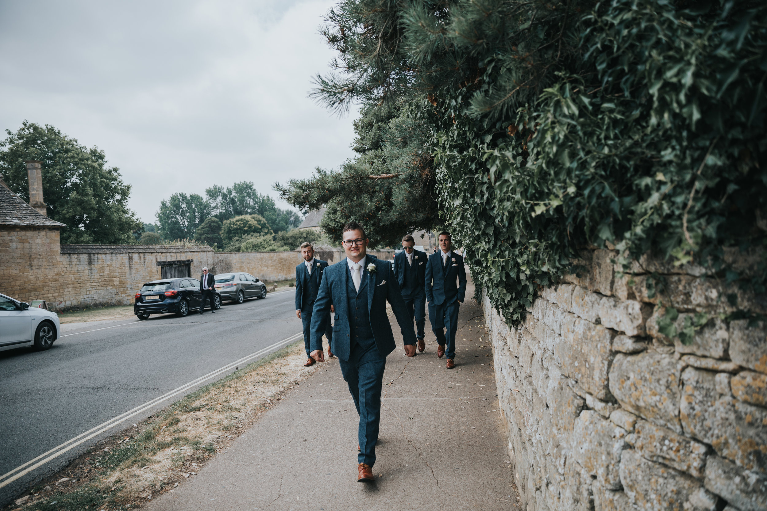Groom leading his groomsmen to the church. (Copy)