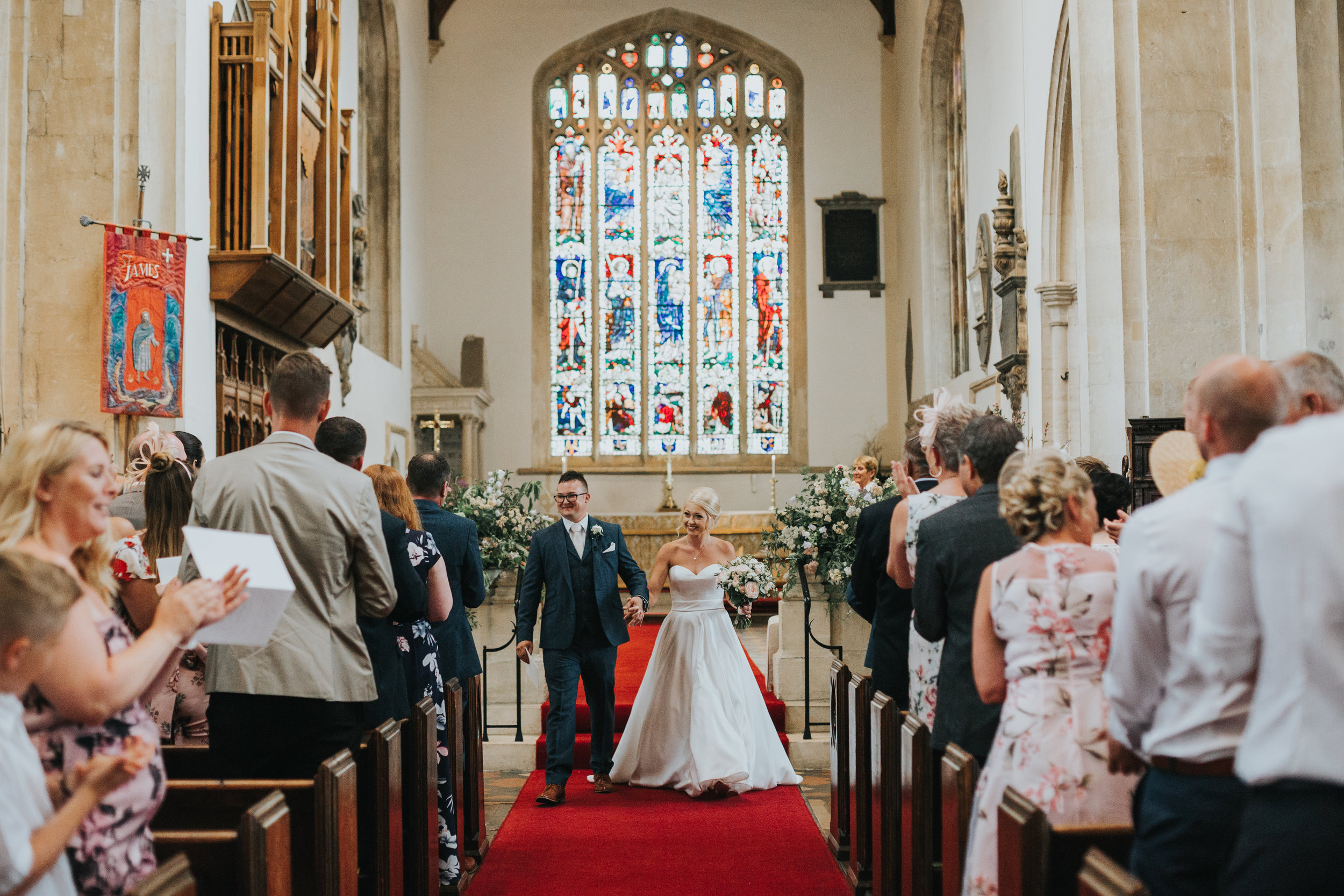 Bride and groom walk down the aisle as husband and wife.  (Copy)