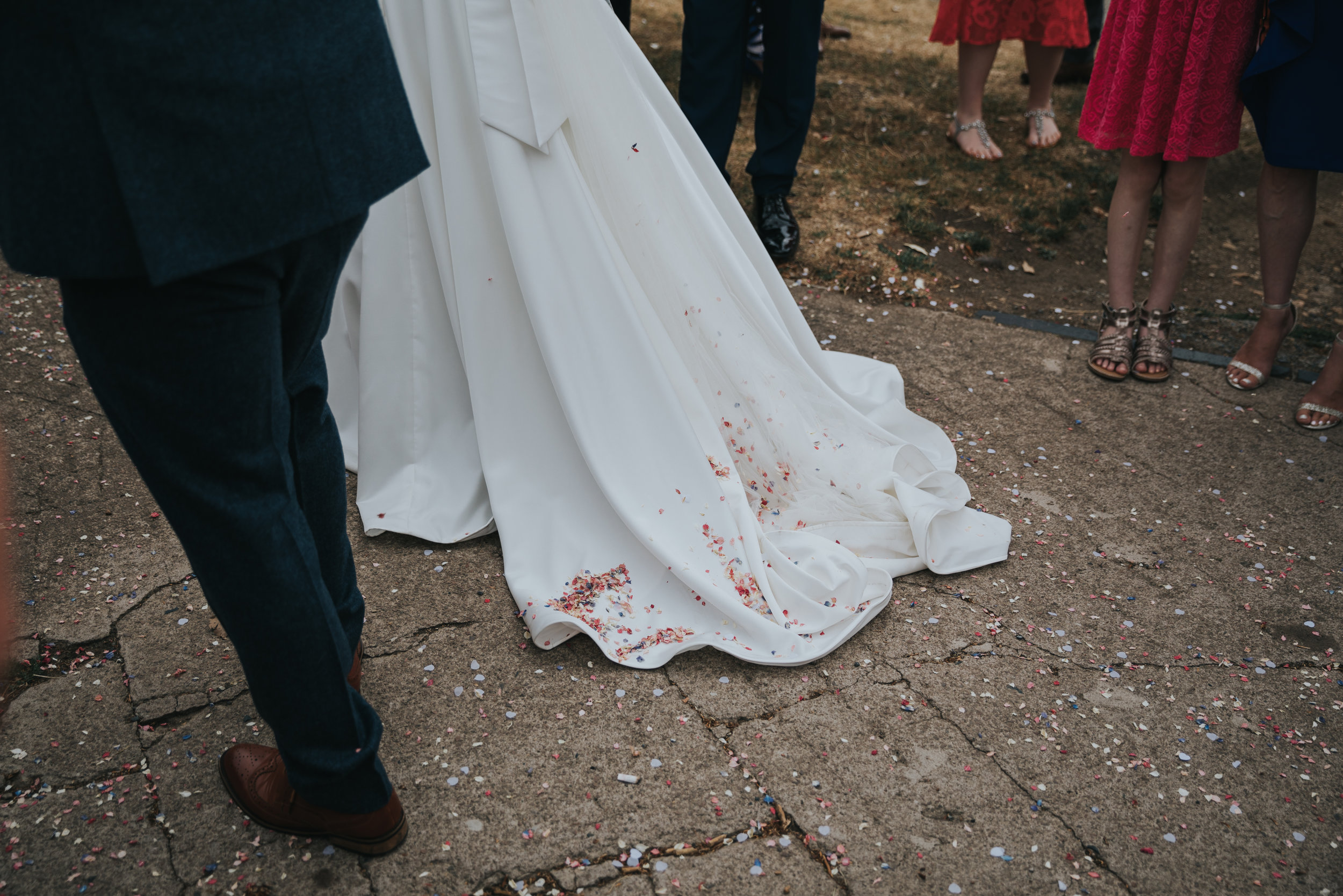 Confetti on brides dress.  (Copy)