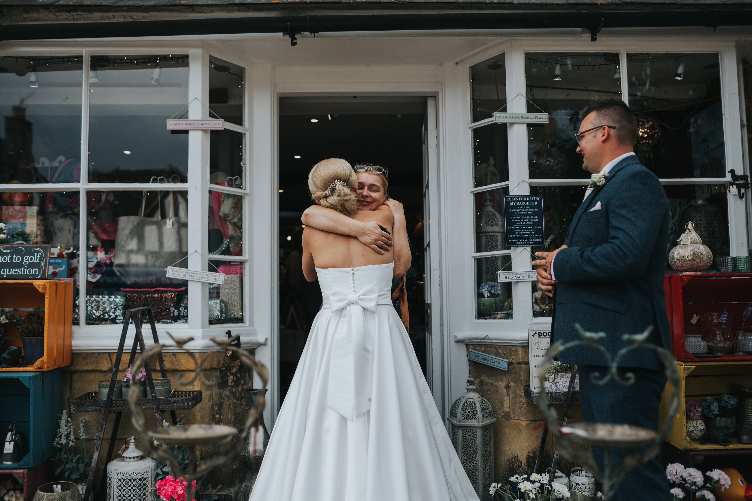 Bride hugs shop keeper.  (Copy)