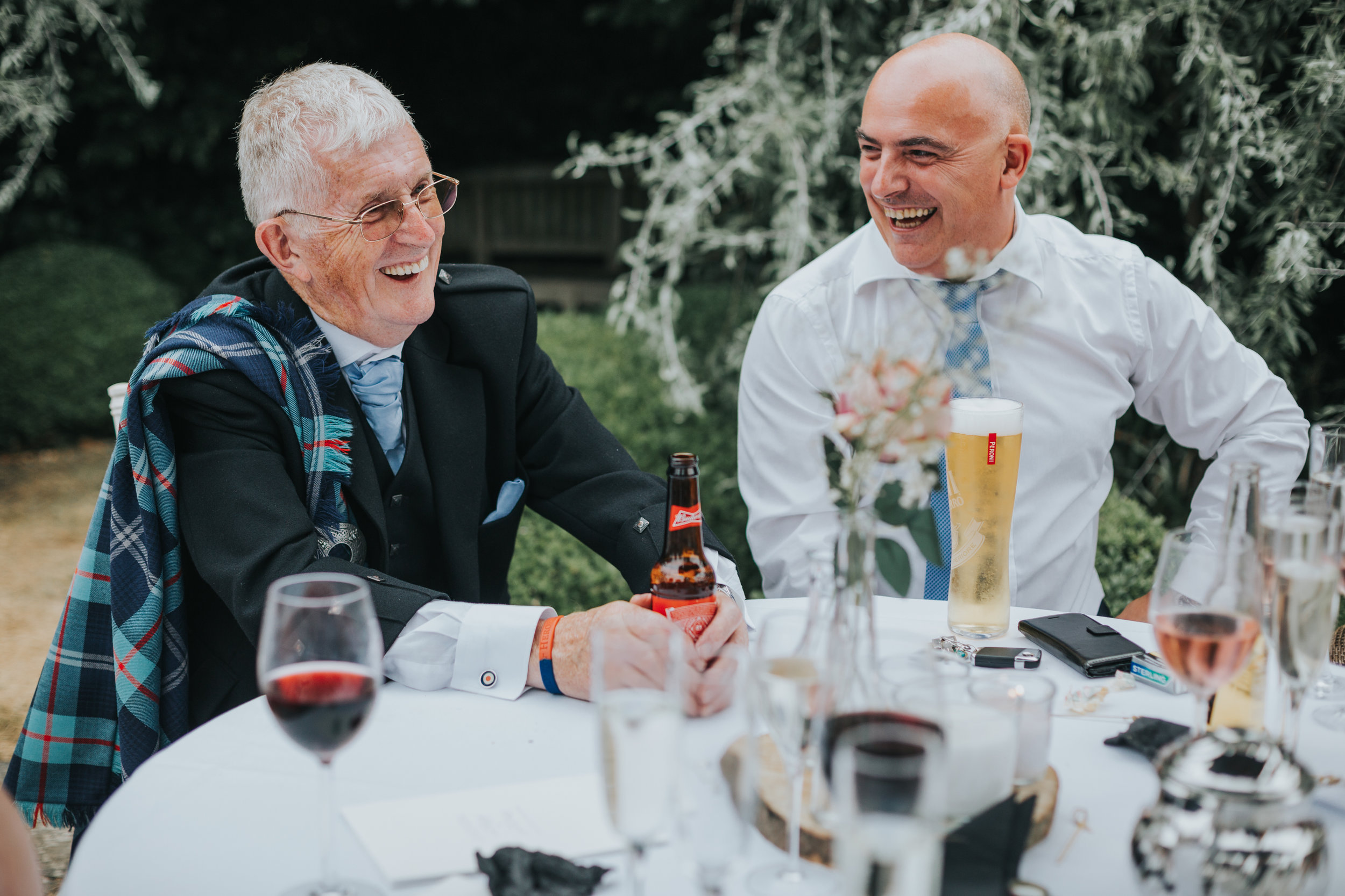 Two male guests laughing together.  (Copy)