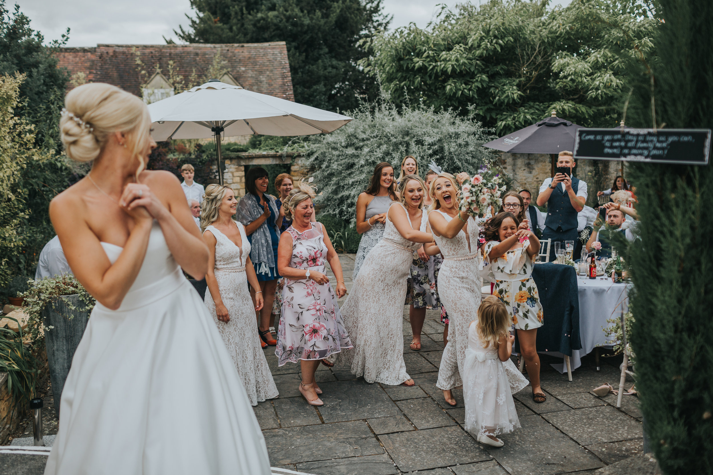 Brides sister is very excited to have caught the bouquet.