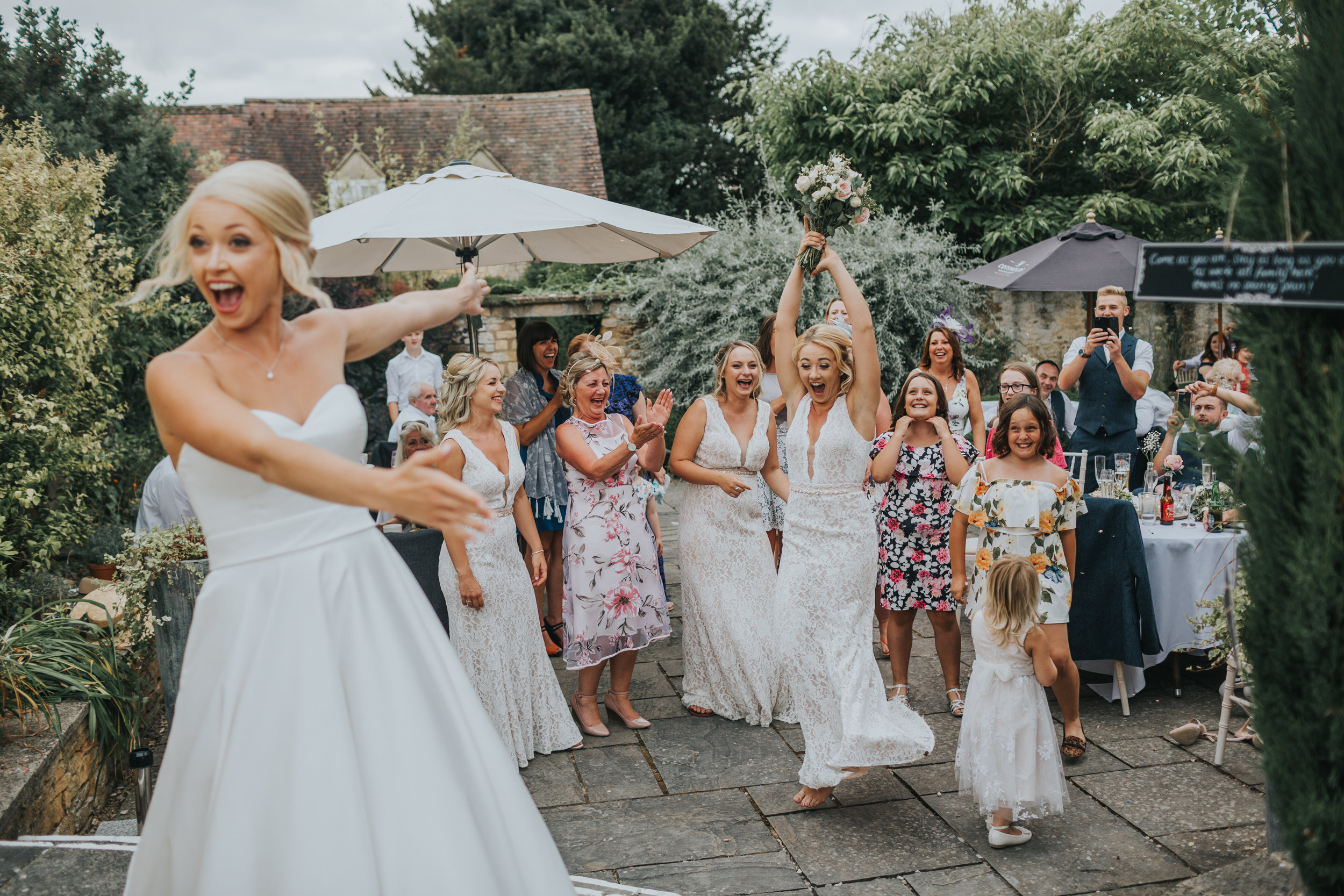 The Bride is also very excited her sister has caught the bouquet.  (Copy)