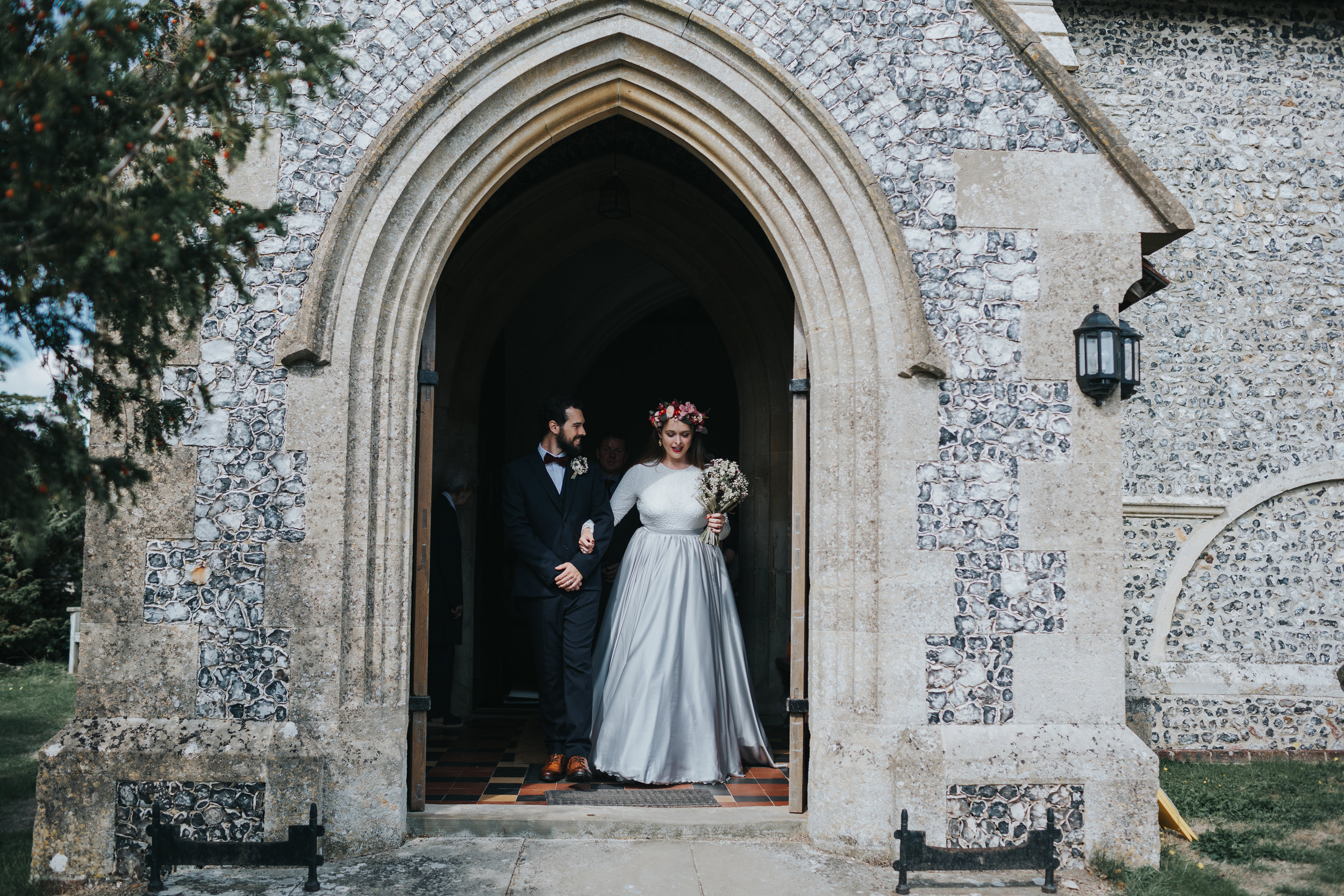 Bride and Groom leaving St Mary's Church, Aldworth together as a married couple.  