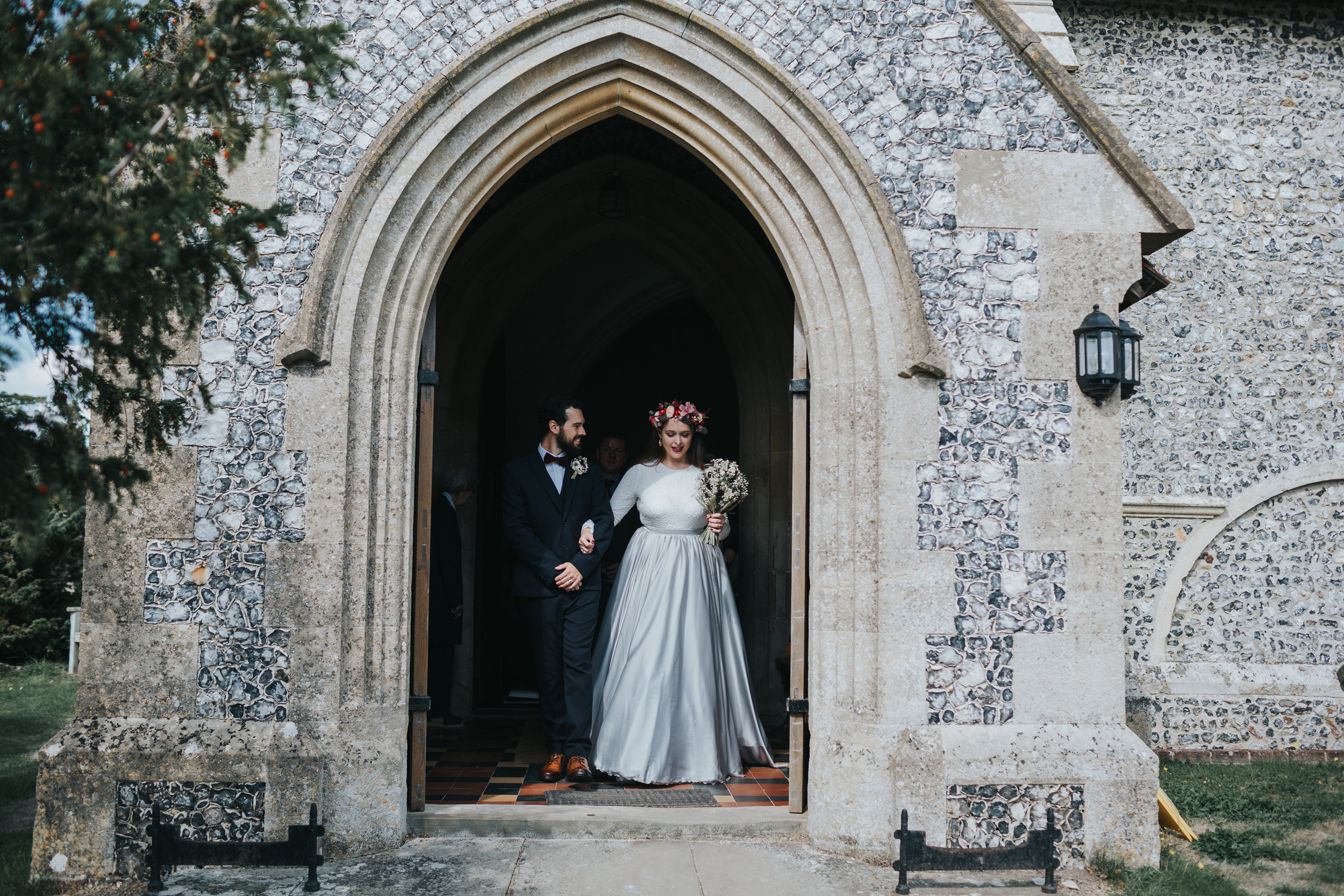 Bride and Groom leaving St Mary's Church, Aldworth together as a married couple.