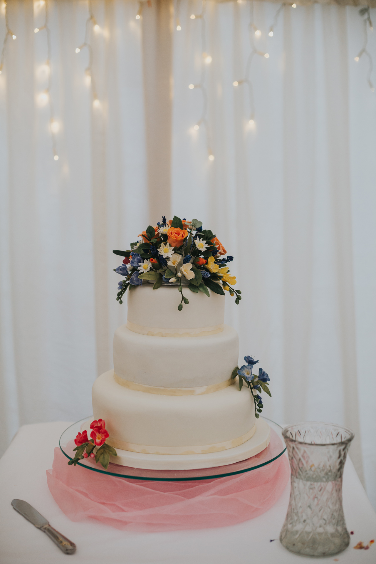 Wedding cake decorated with flowers.