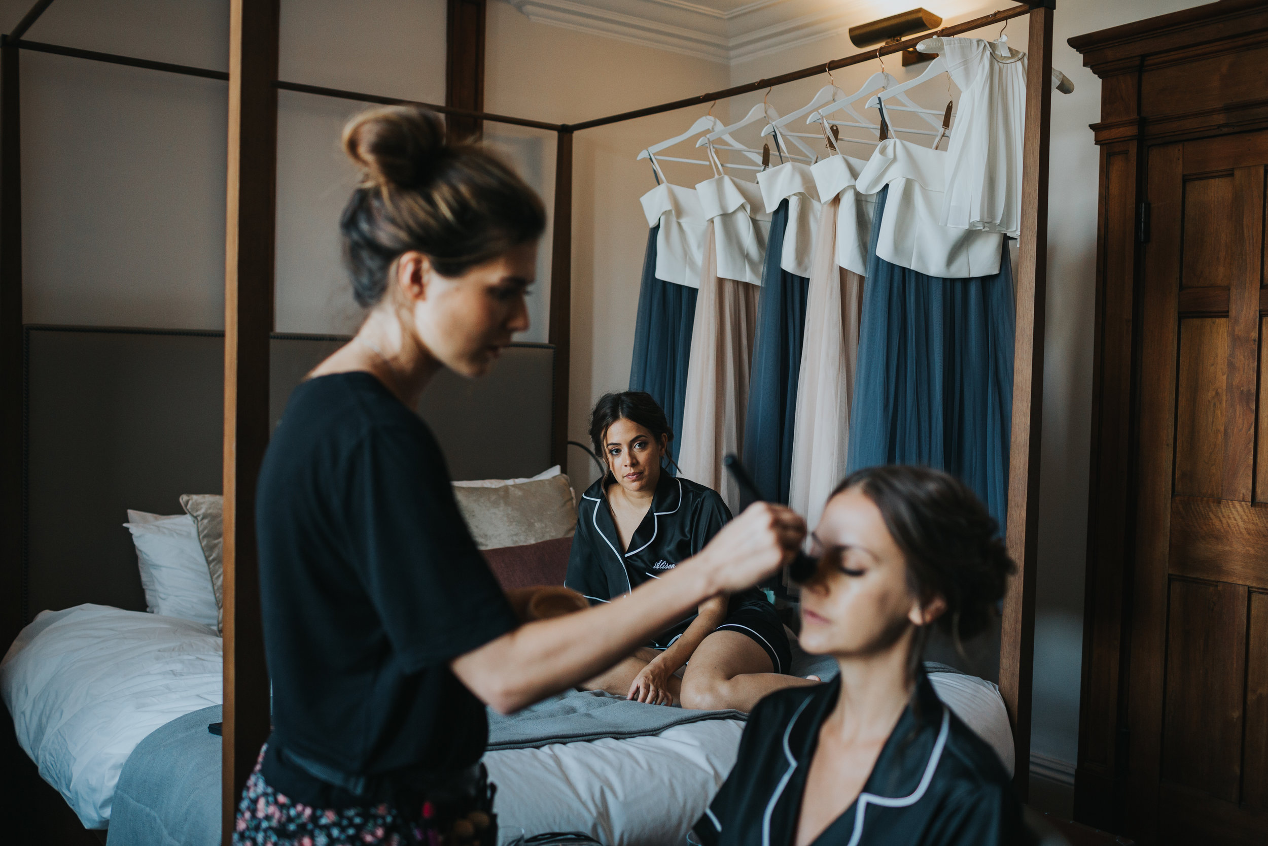 Bridesmaid gets her make up done. 