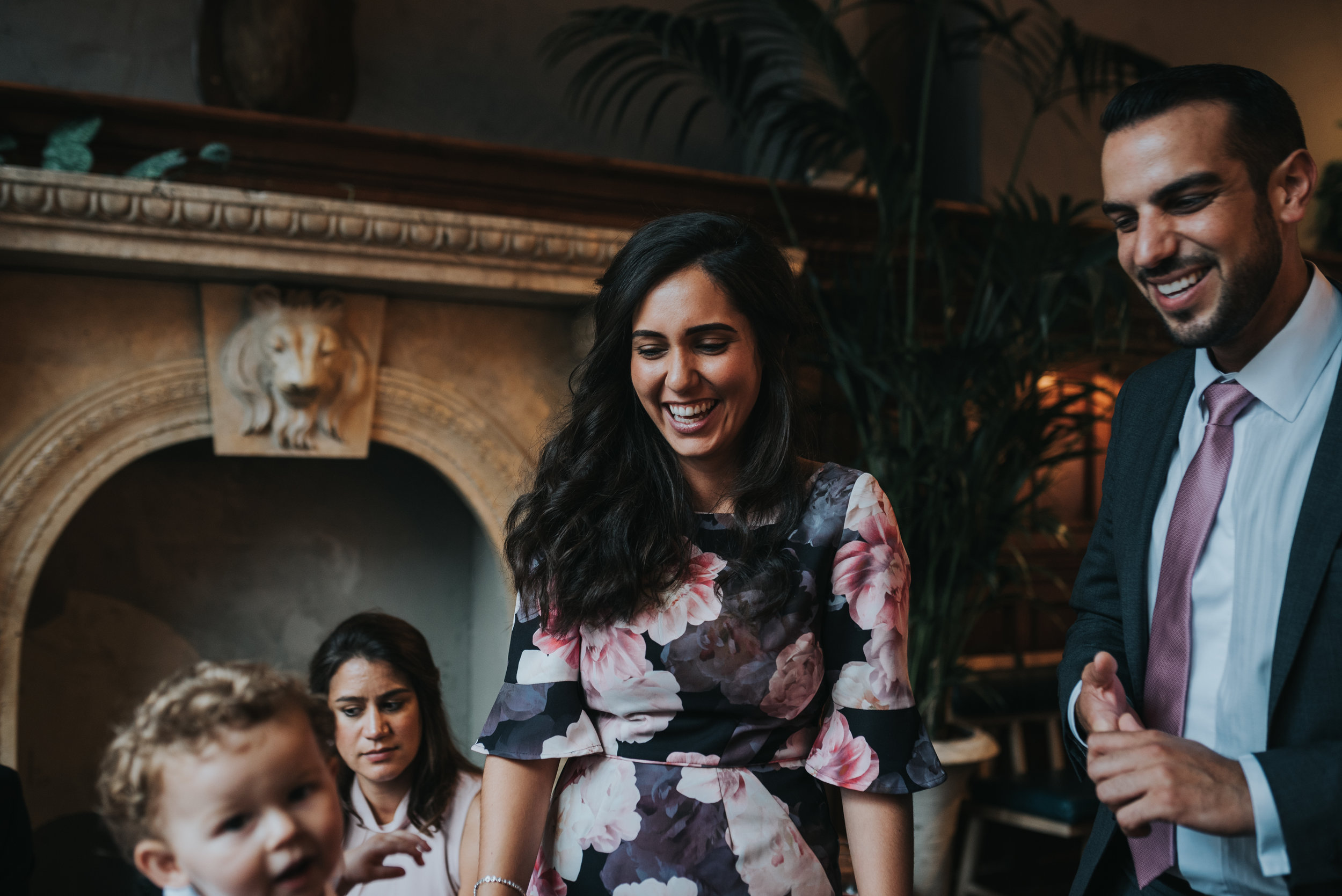 Wedding guests smiling playing with children