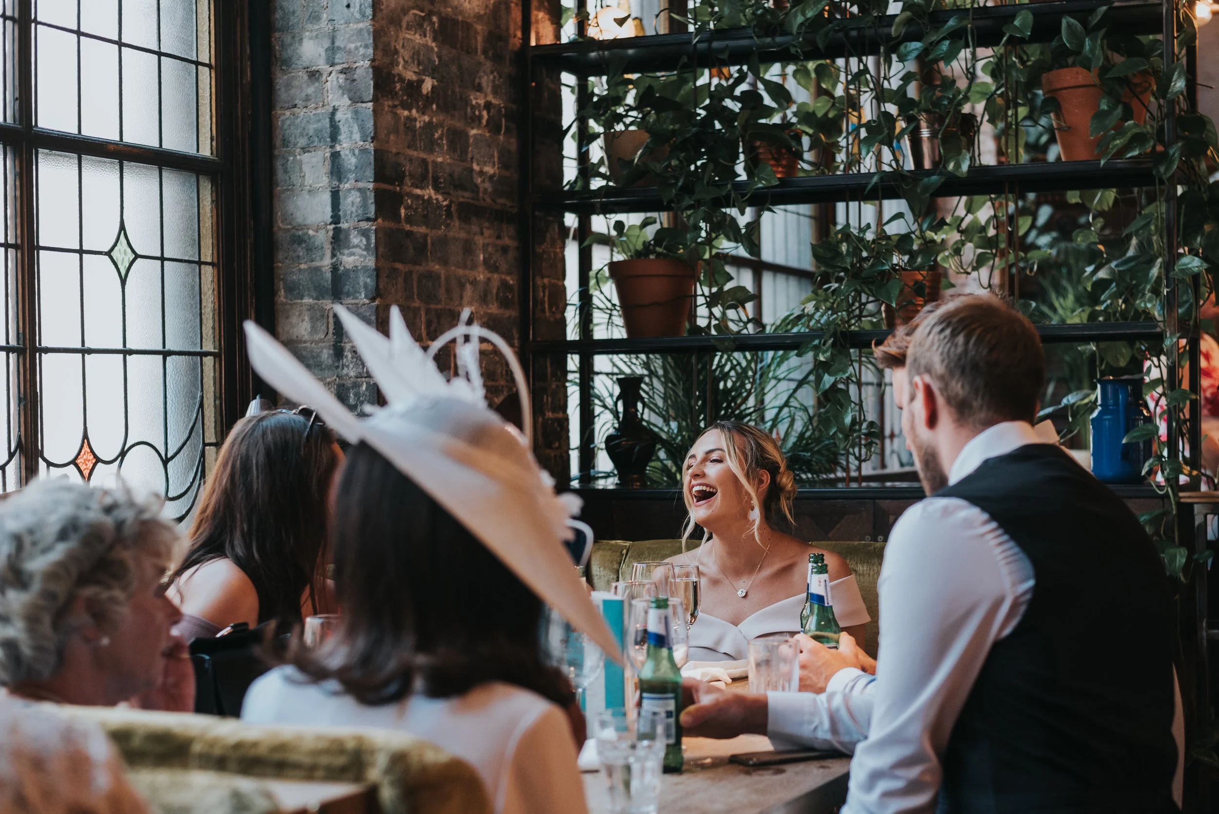 Wedding guests laughing.