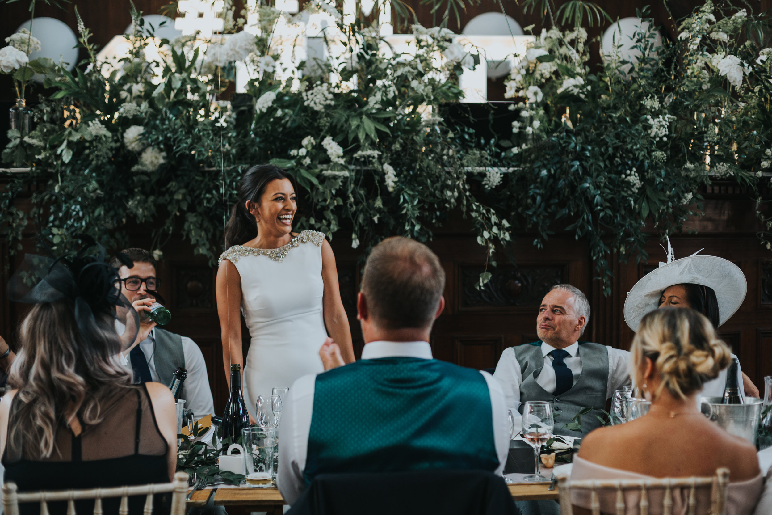 Bride stands to make her speech. 