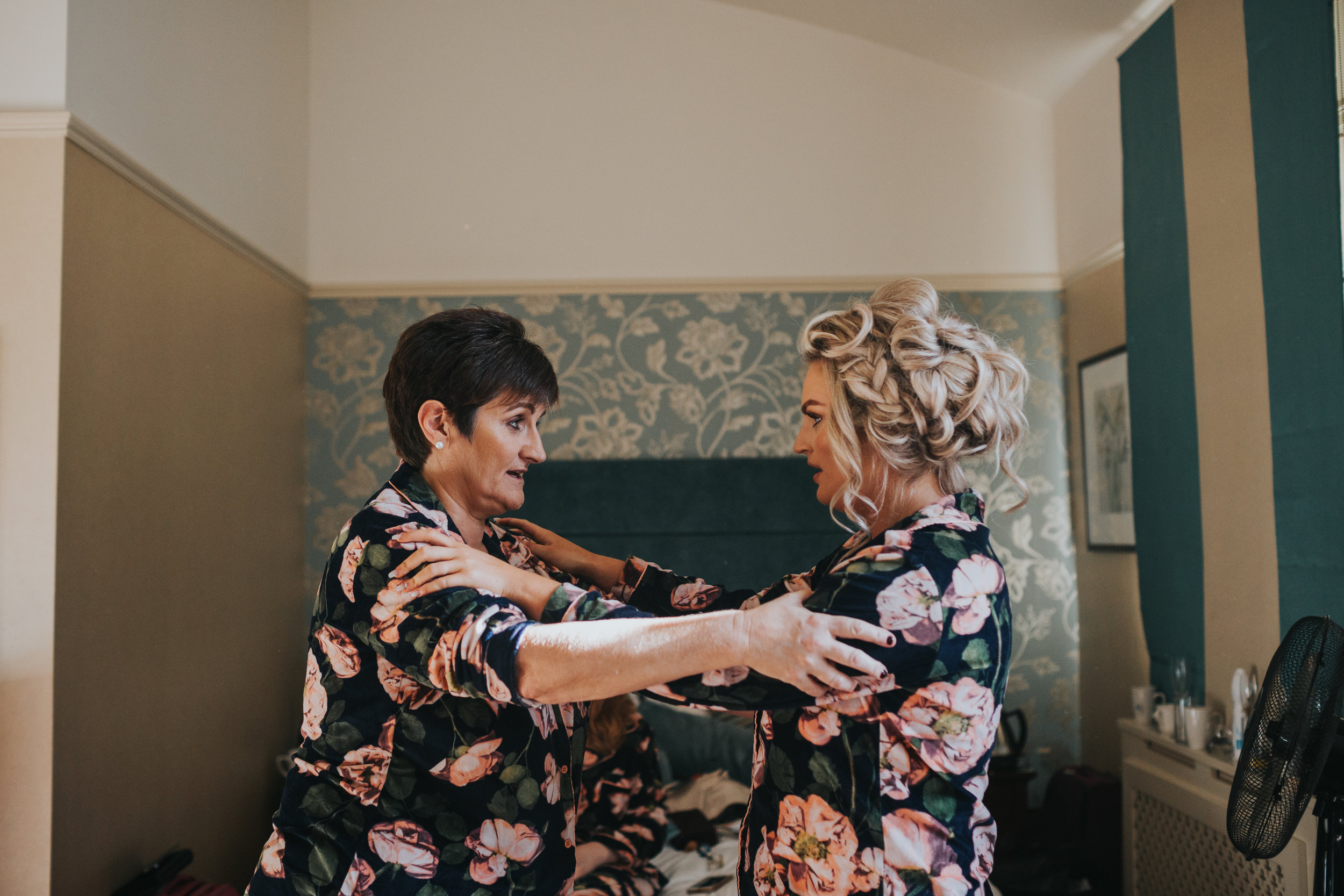 Mother of the Bride and the Bride have a moment together on the morning of the wedding.