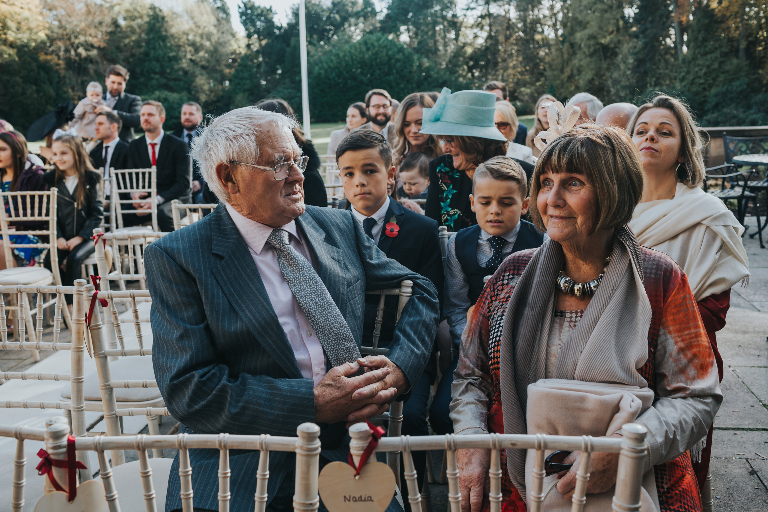 Guests enjoy the sunshine while awaiting the Bride at an outdoor ceremony at Inglewood Manor. 