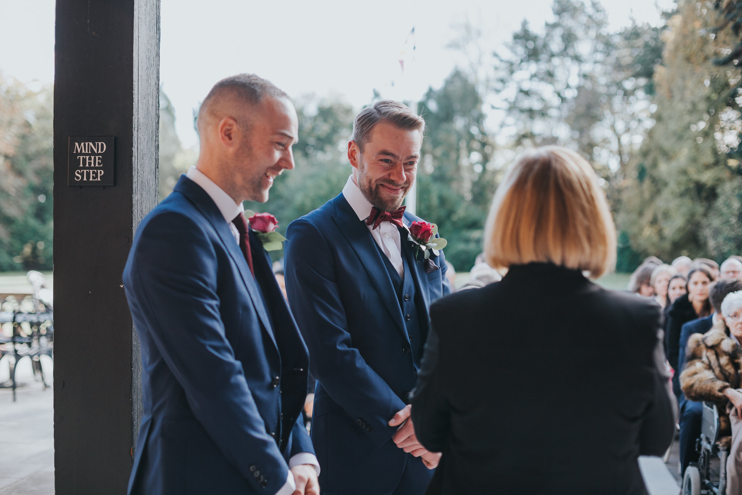 The groom, best man and registrar share a joke.