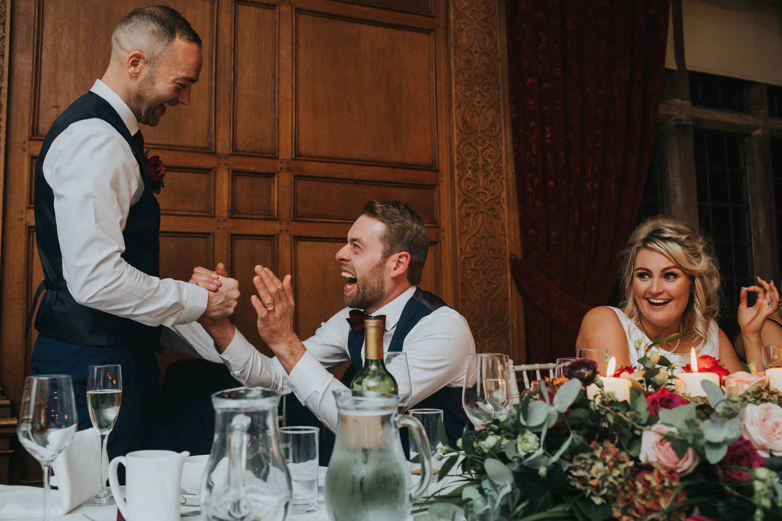The Groom congratulates the Best Man on his speech.