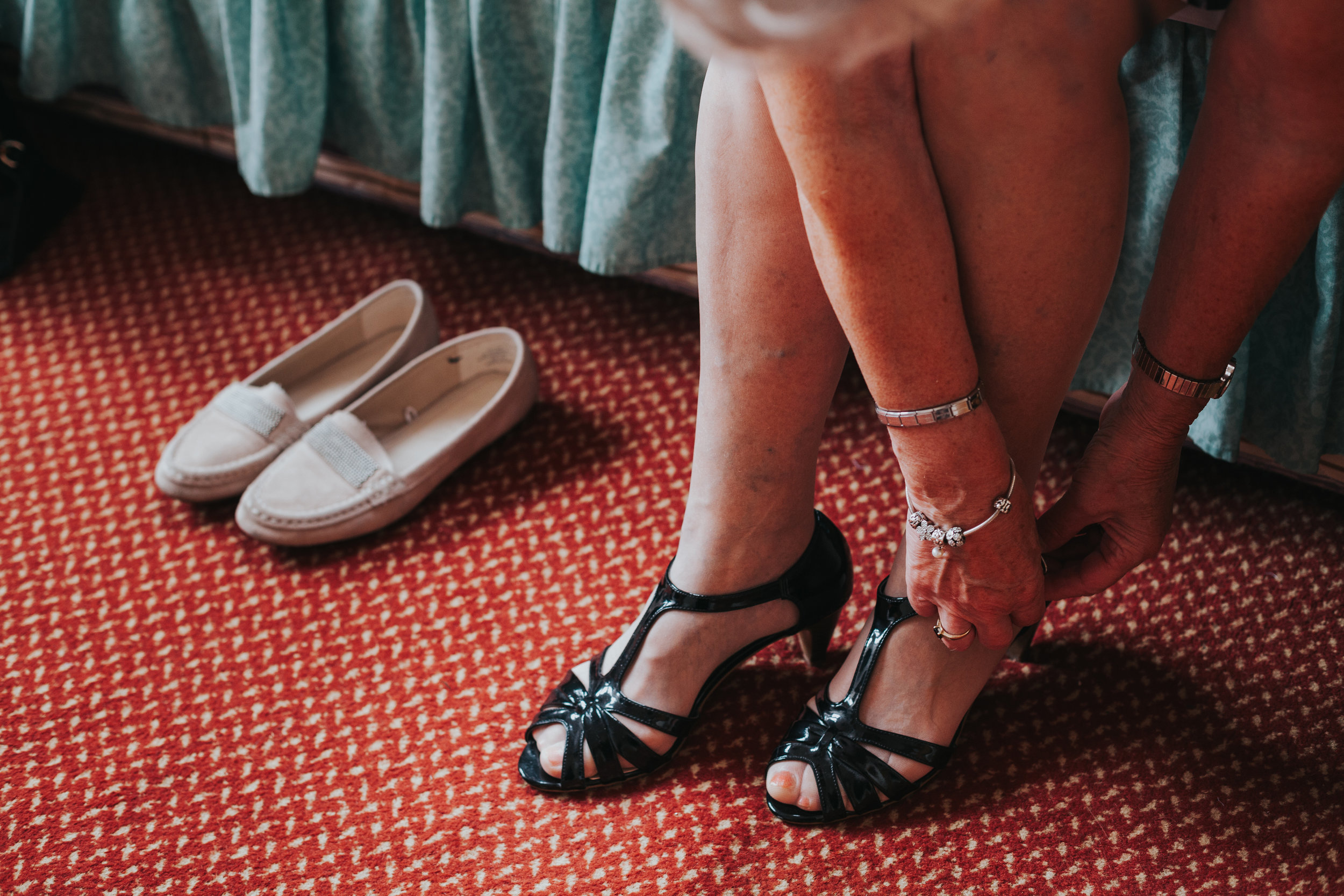 Nan swaps her slippers for her heeled wedding shoes. 