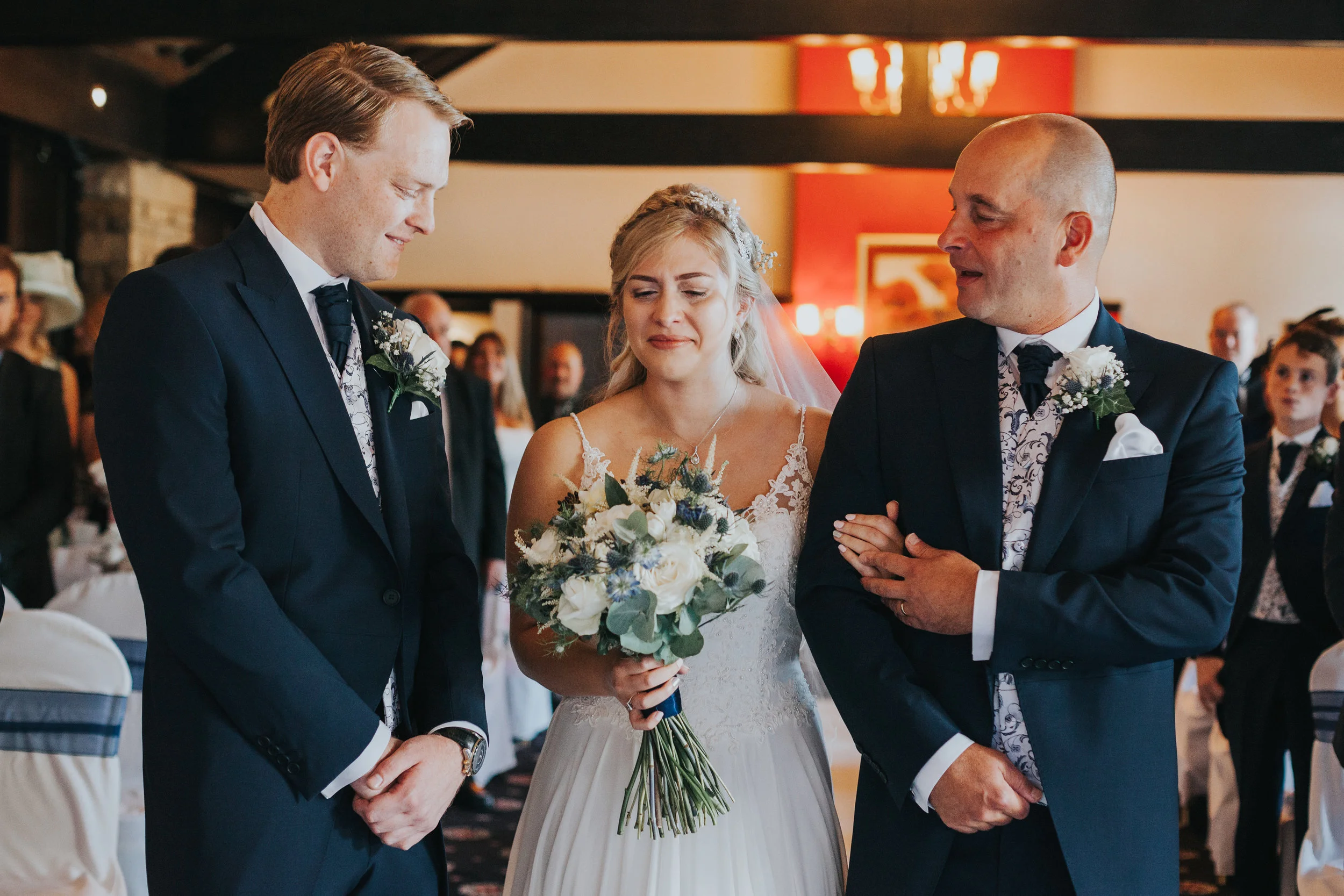 Bride is overcome with emotion as she reaches her groom. 