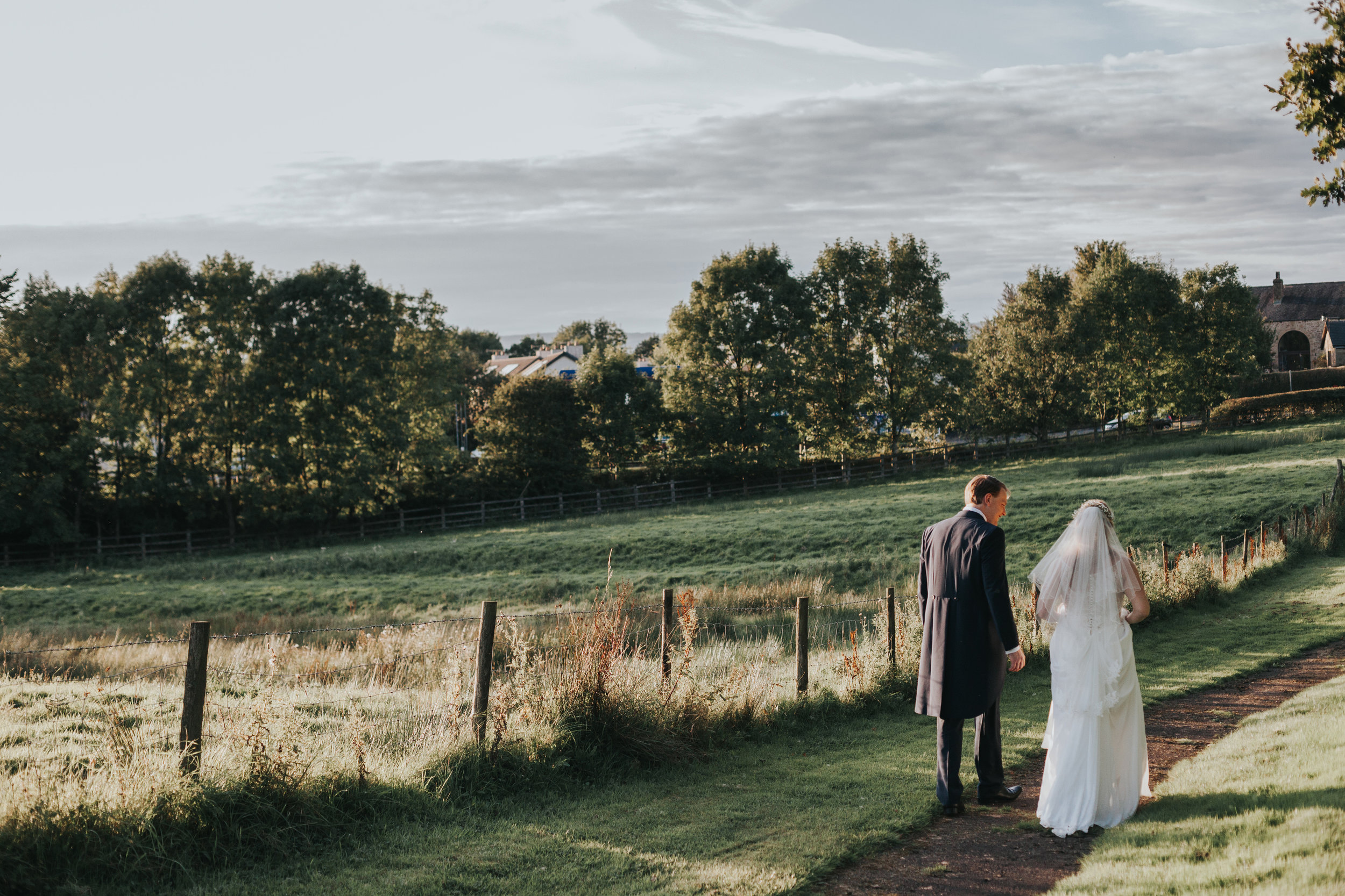 Bride and Groom walk away together.