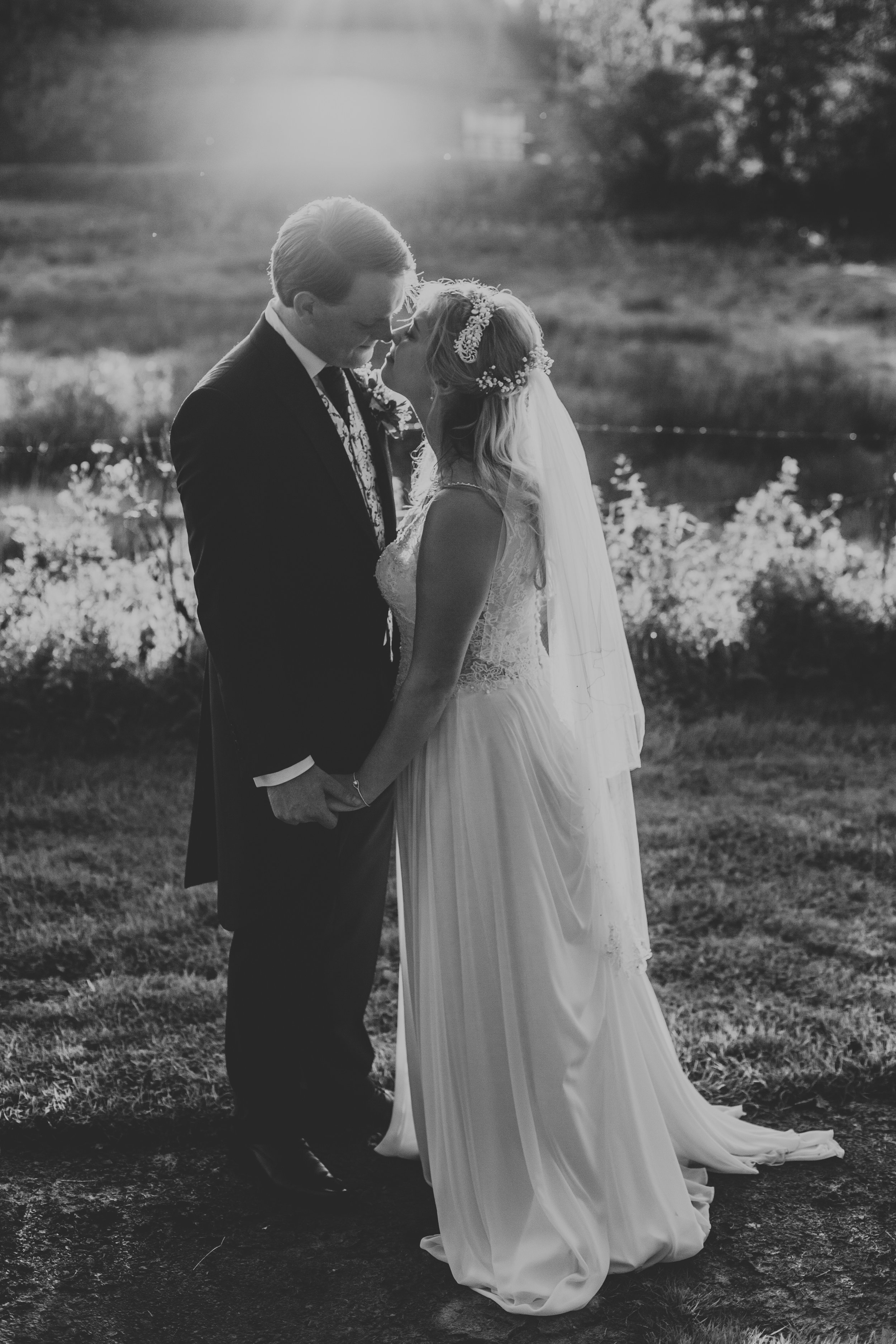 Bride and Groom kiss photo in black and white. 