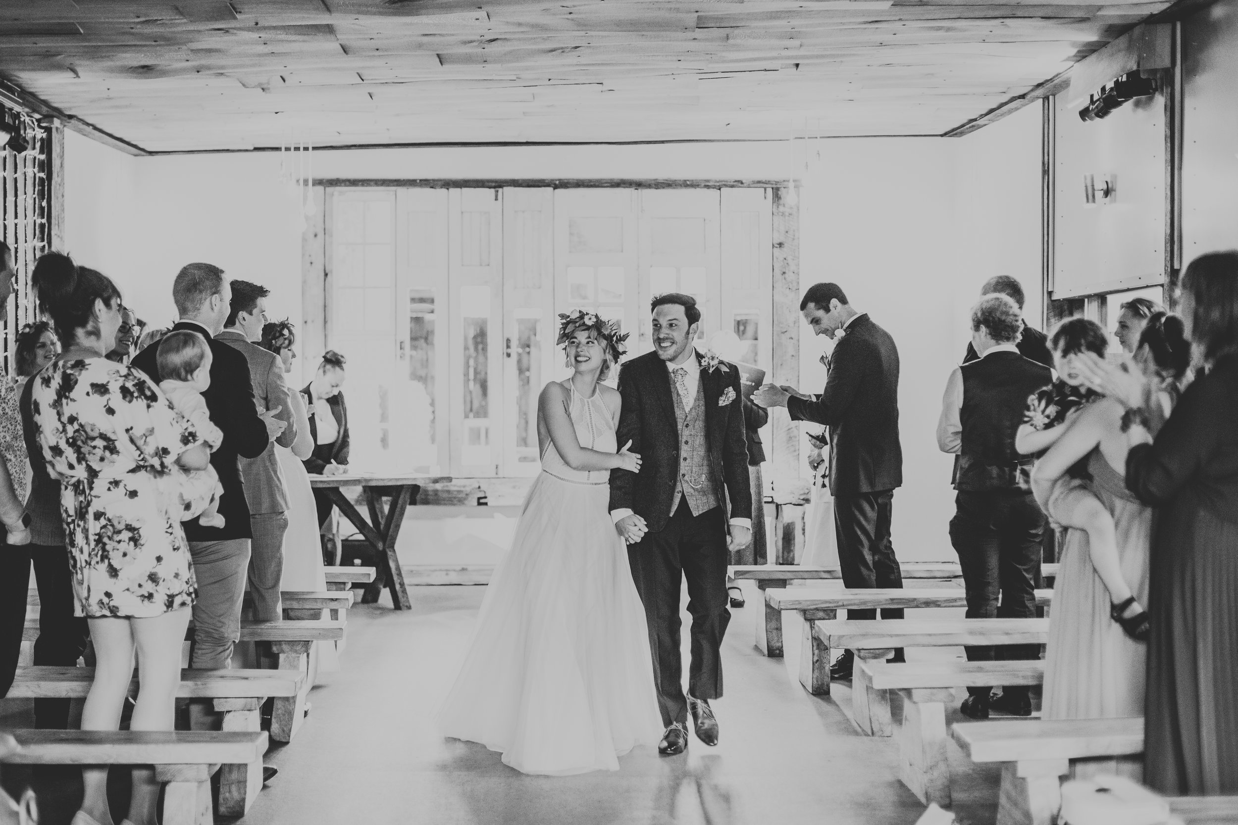 Bride and Groom make their way down the aisle as husband and wife. 