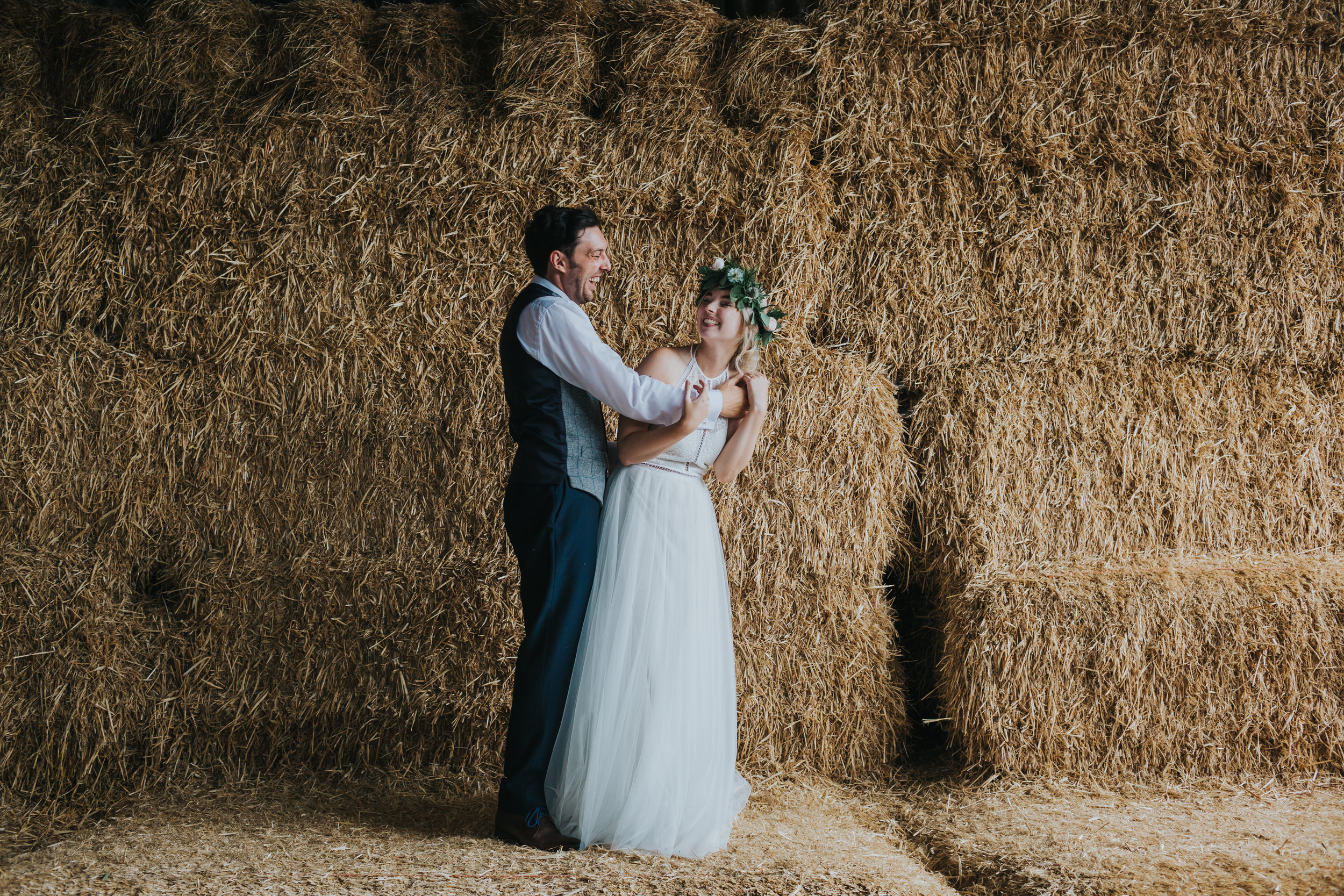 Bride and groom larking about at Owen House Wedding Barn. 