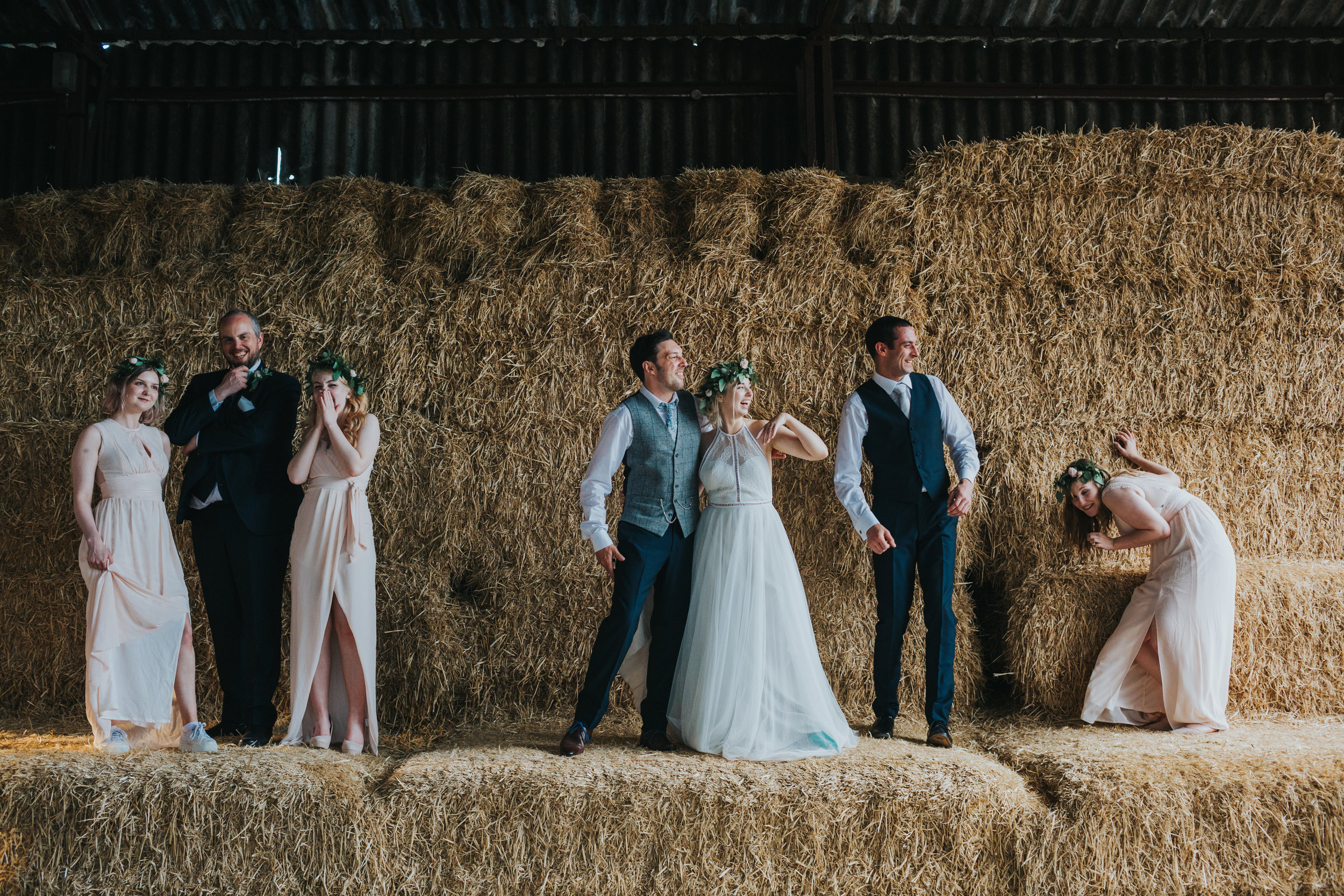 The bridal party are attacked by a wasp as they pose for a photo. 