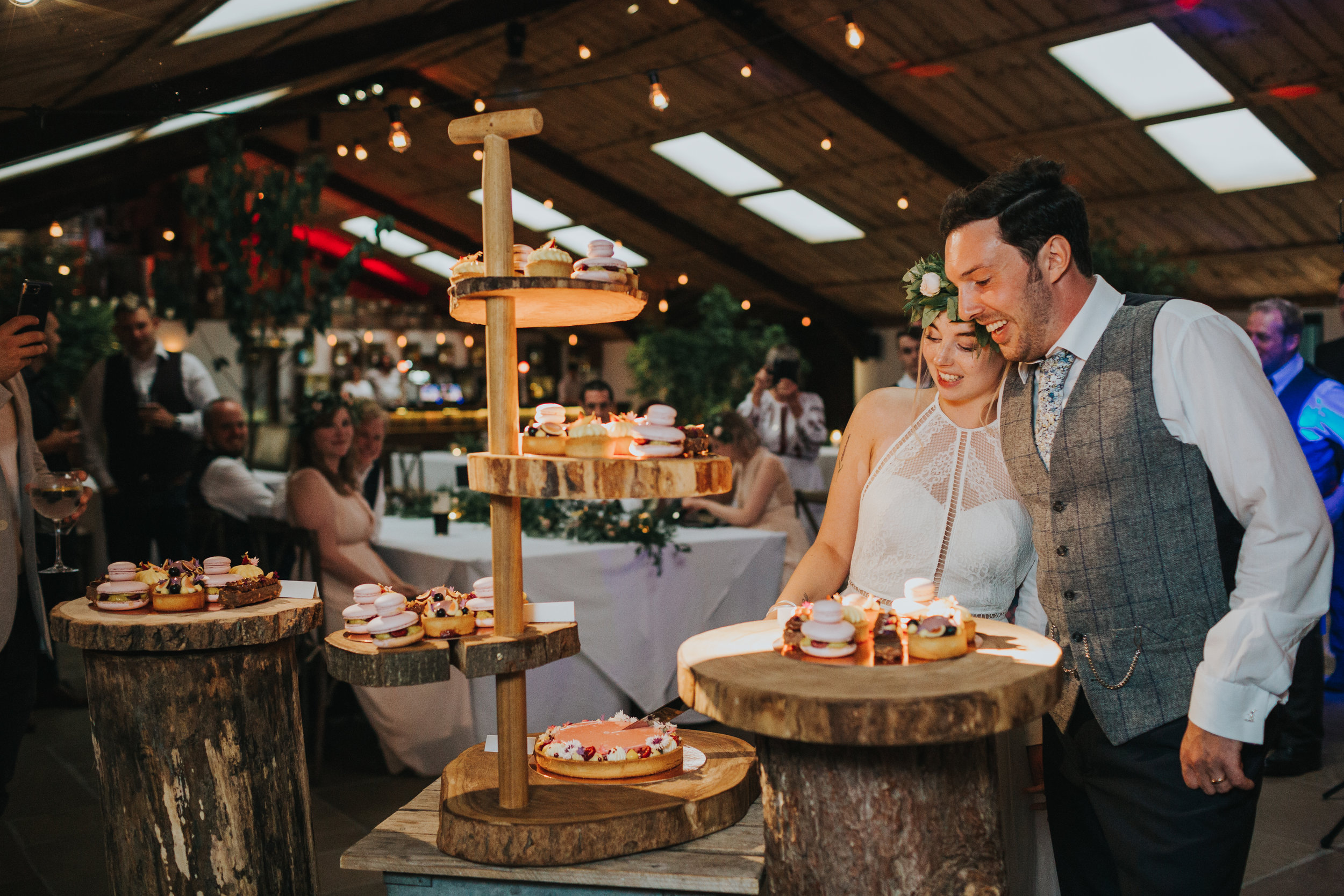 Bride and groom cut the cake.